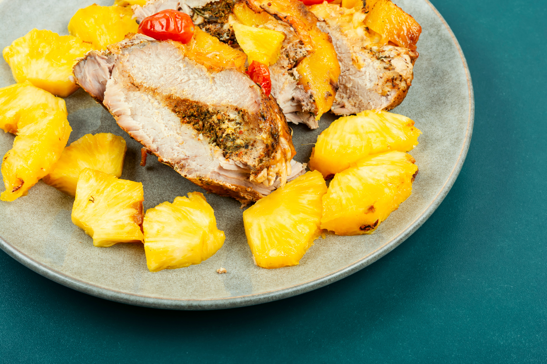 Overhead flat-lay of all ingredients for African Peri Peri Chicken with Grilled Pineapple Salsa laid out on a kitchen surface.