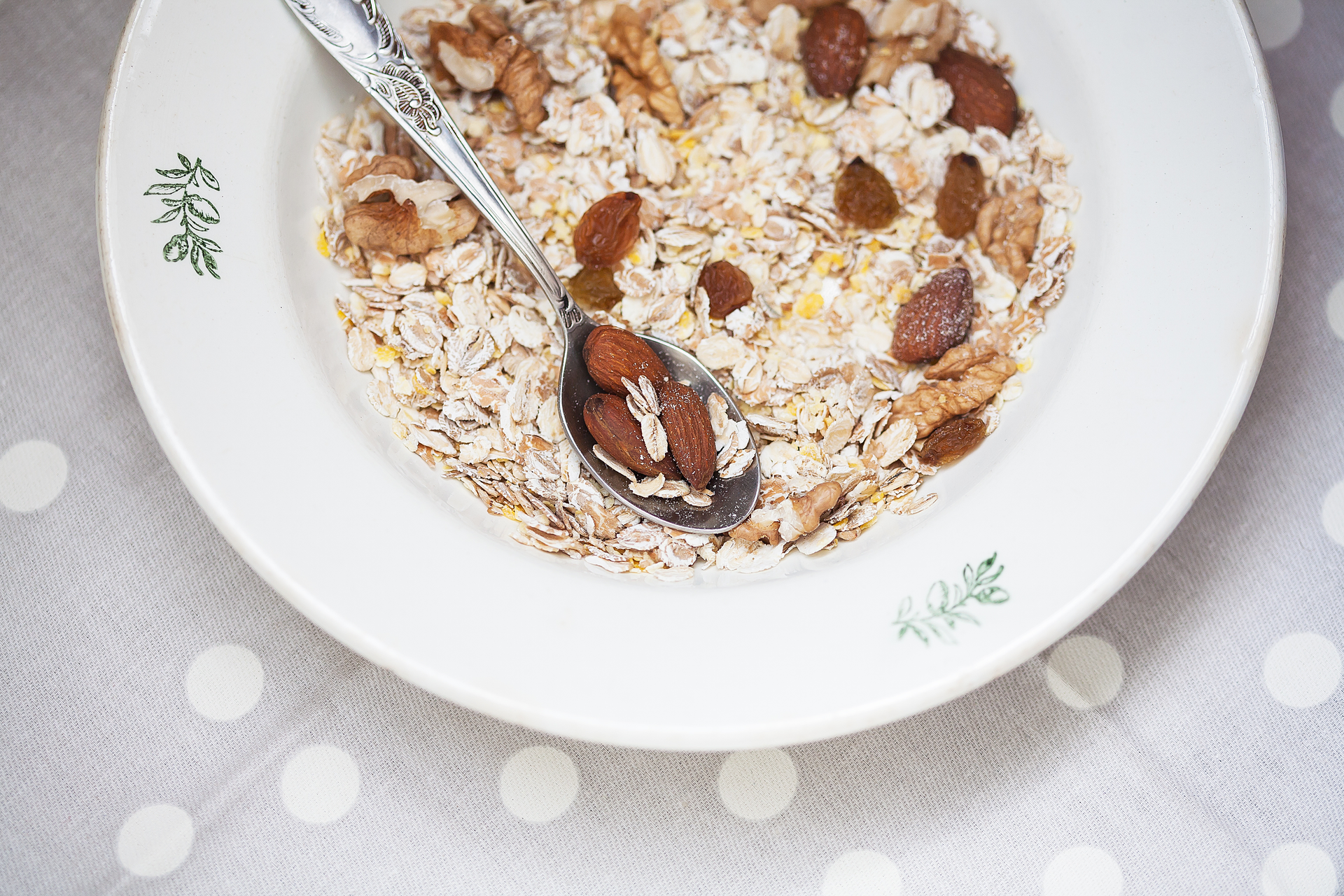 Overhead flat-lay of all ingredients for Almond and Raisin Rice Pilaf laid out on a kitchen surface.