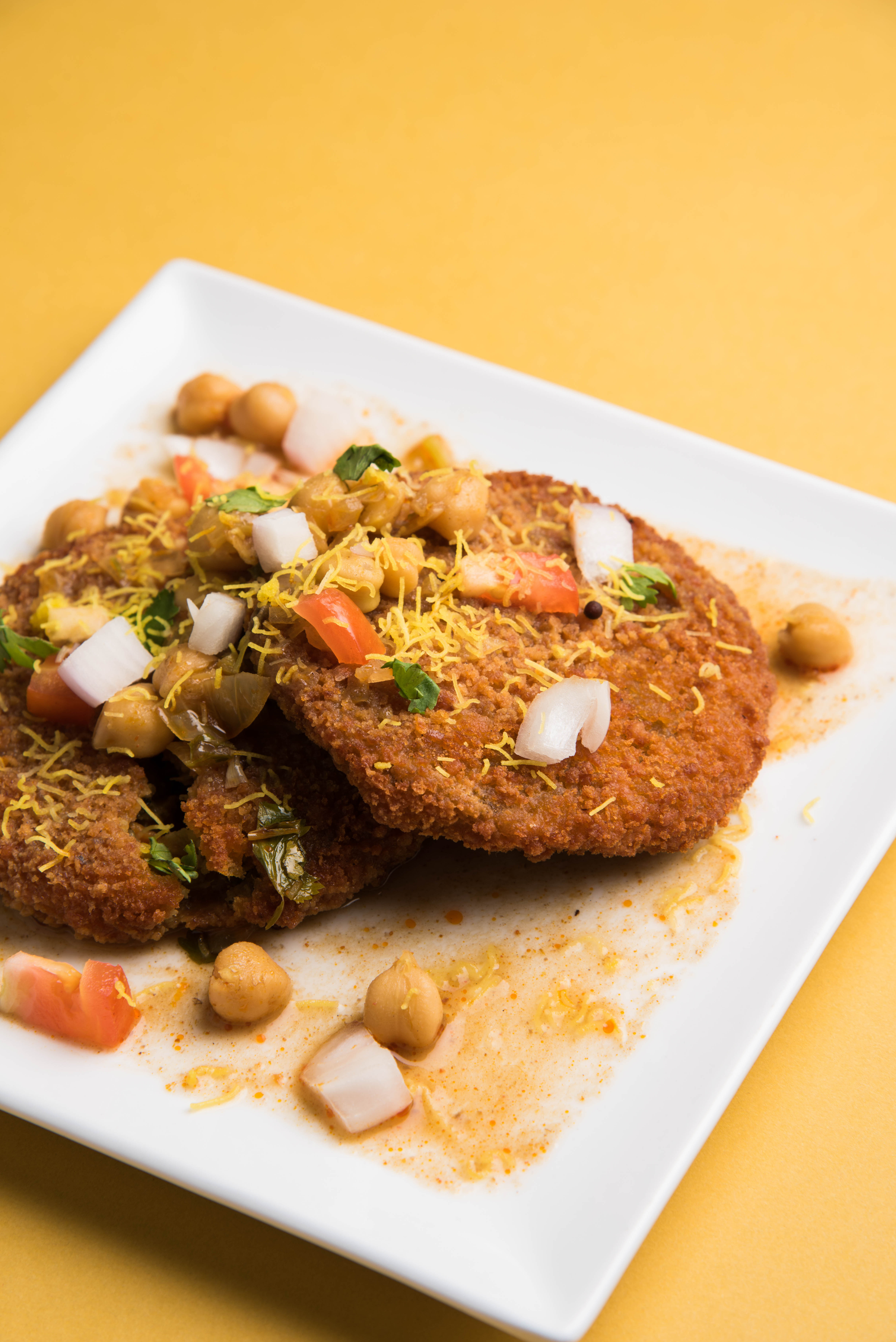 Overhead flat-lay of all ingredients for Amritsari Fish Fry with Carom Seed Batter laid out on a kitchen surface.