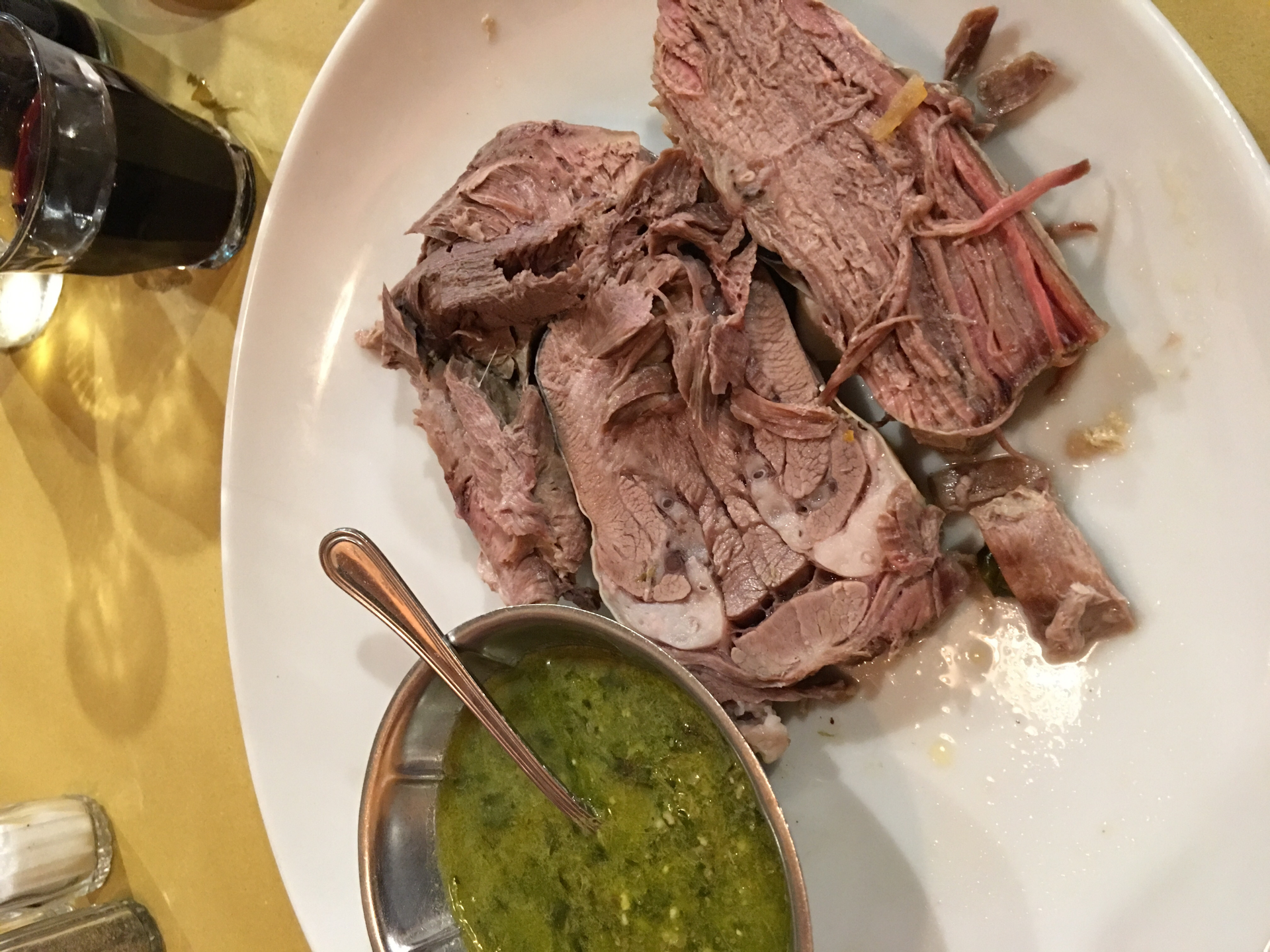 Overhead flat-lay of all ingredients for Argentinian Salsa Criolla with Grilled Beef laid out on a kitchen surface.