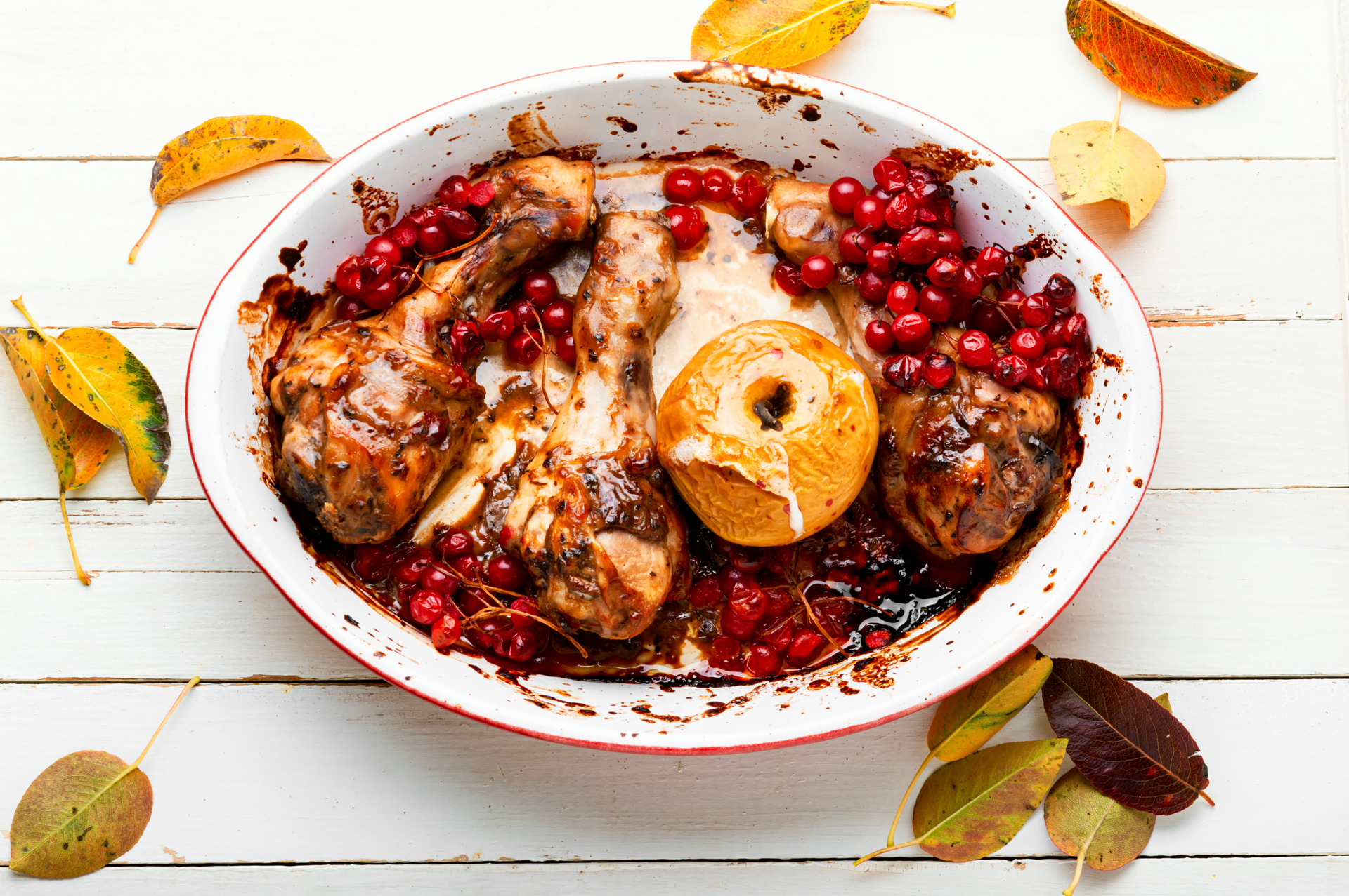 Overhead flat-lay of all ingredients for Armenian Pomegranate Aleppo Chicken with Walnut Sauce laid out on a kitchen surface.
