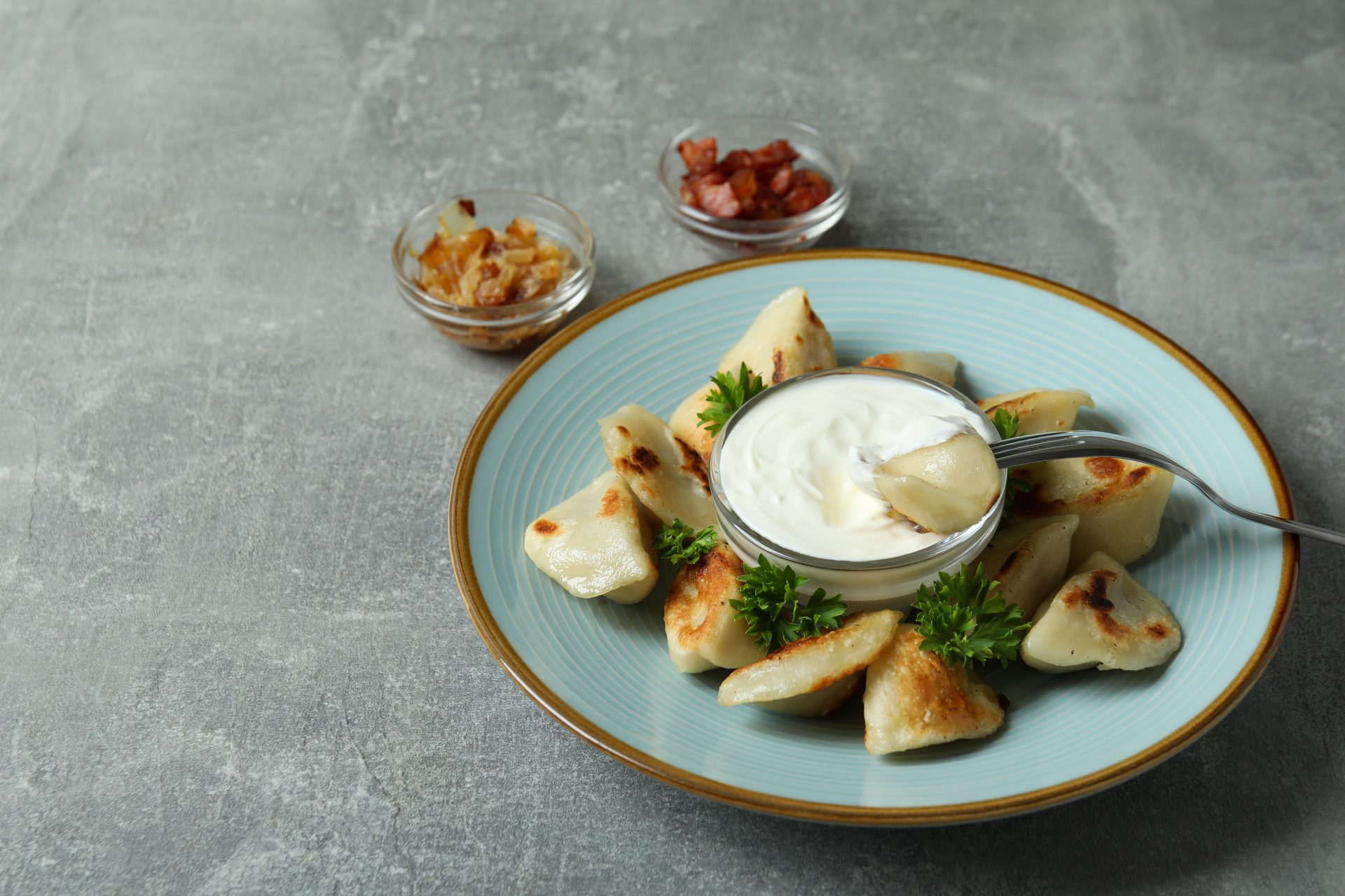 Overhead flat-lay of all ingredients for Aromatic Afghan Ashak Dumplings with Garlic Yogurt Sauce laid out on a kitchen surface.