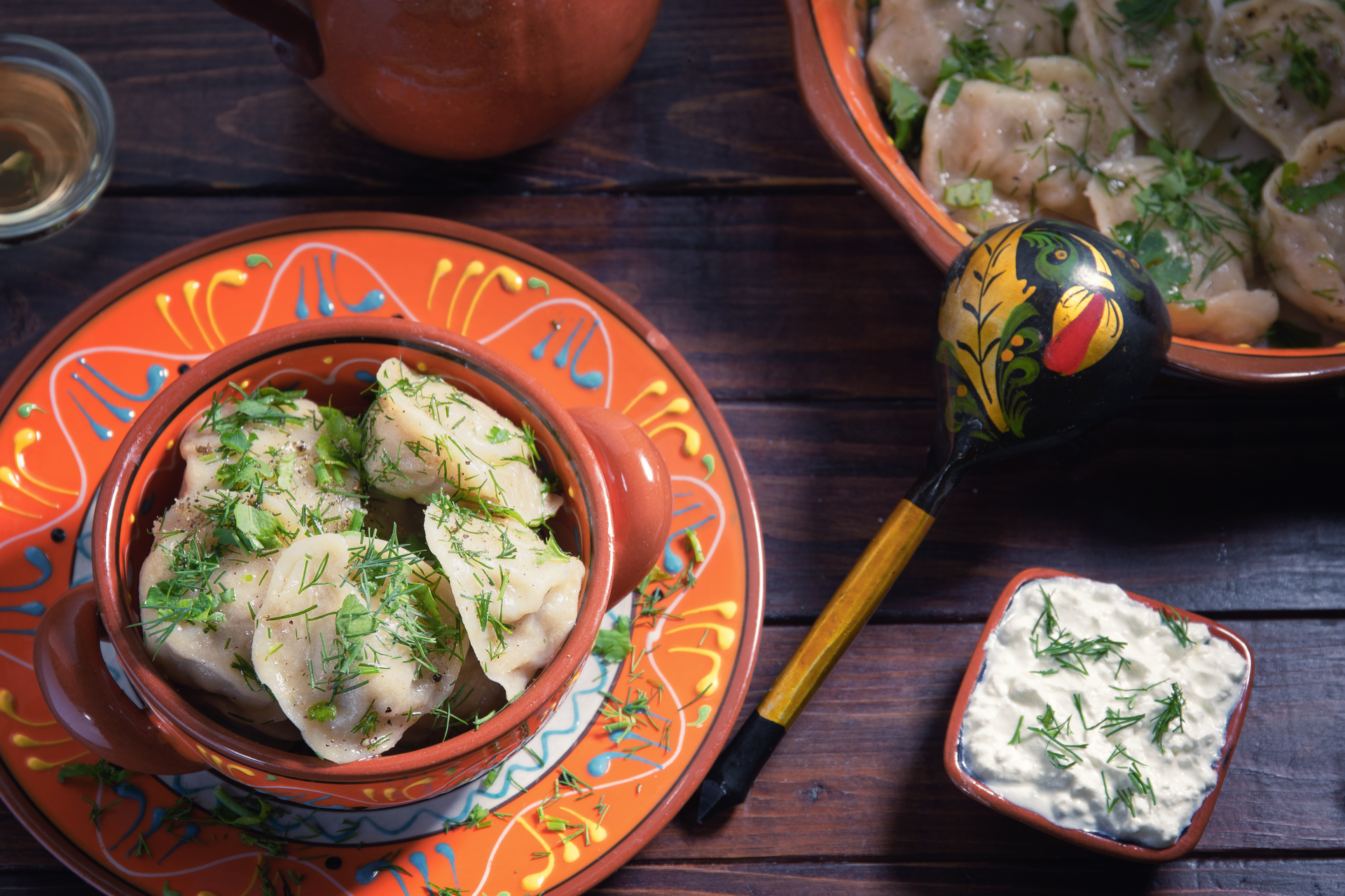 Aromatic Afghan Ashak Dumplings with Garlic Yogurt Sauce — Appetizer served and photographed from above
