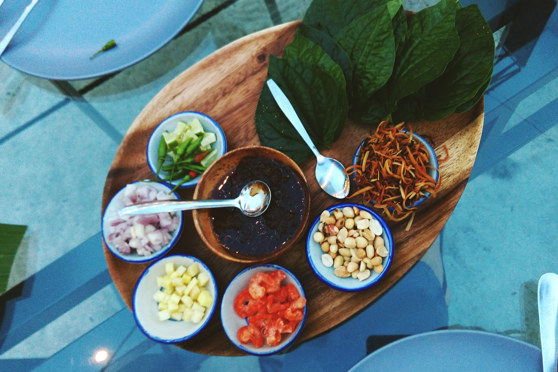 Overhead flat-lay of all ingredients for Aromatic Burmese Ngar Htamin laid out on a kitchen surface.