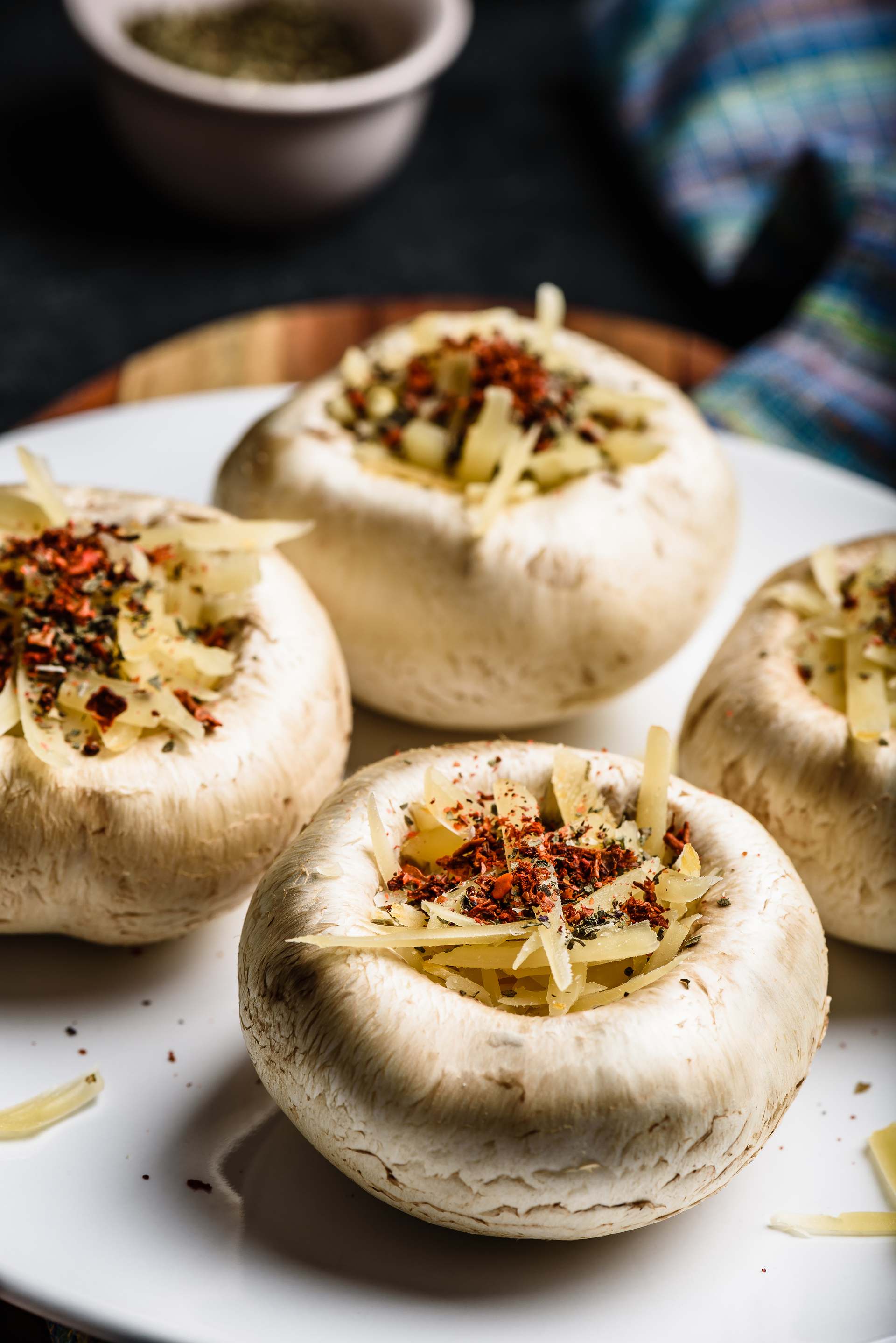 Overhead flat-lay of all ingredients for Aromatic Georgian Khinkali with Mushroom and Walnut Filling laid out on a kitchen surface.