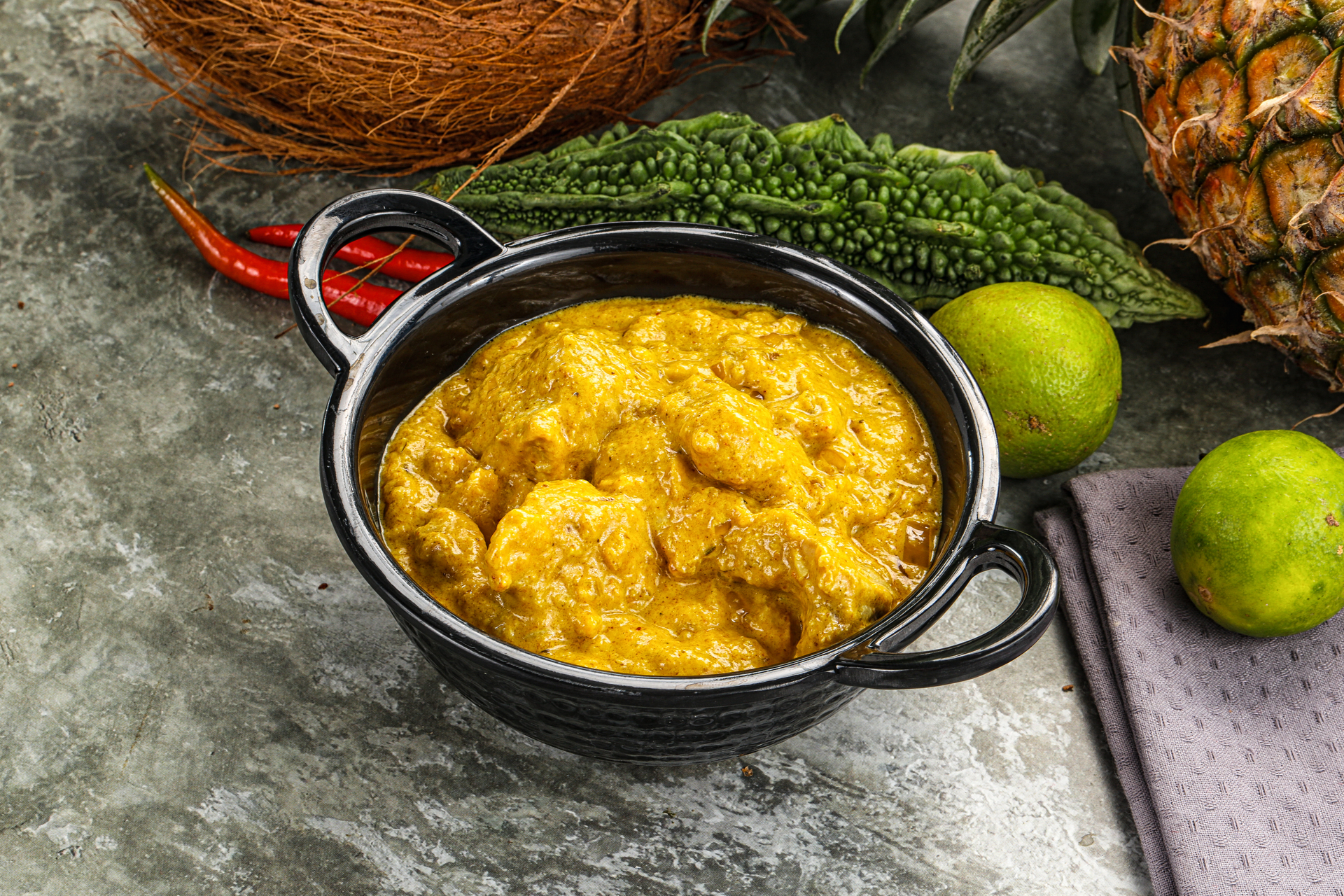 Overhead flat-lay of all ingredients for Aromatic Indian Mango Curry with Coconut and Mustard Seeds laid out on a kitchen surface.