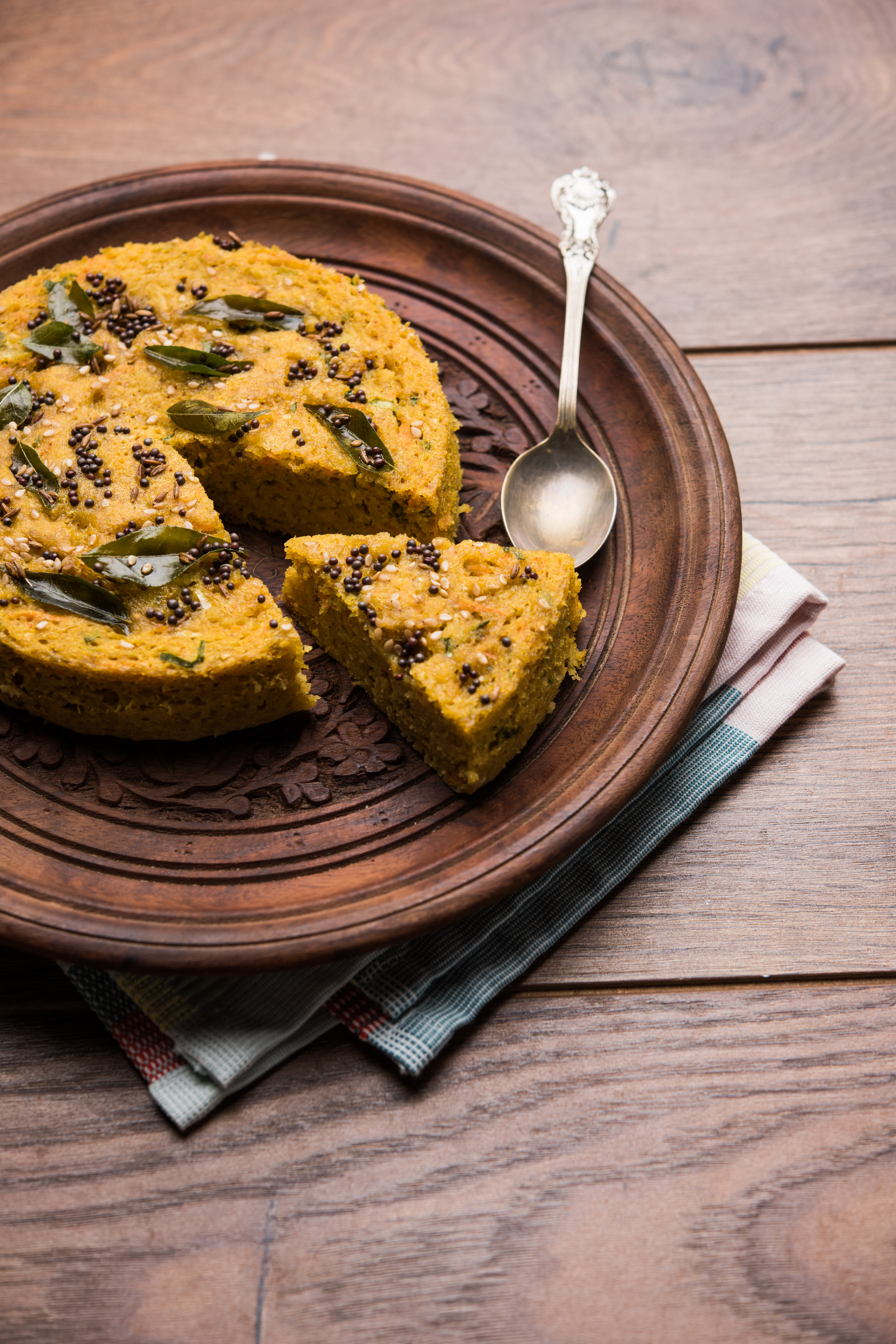 Overhead flat-lay of all ingredients for Aromatic Indian Methi Thepla with Carrot Pickle laid out on a kitchen surface.