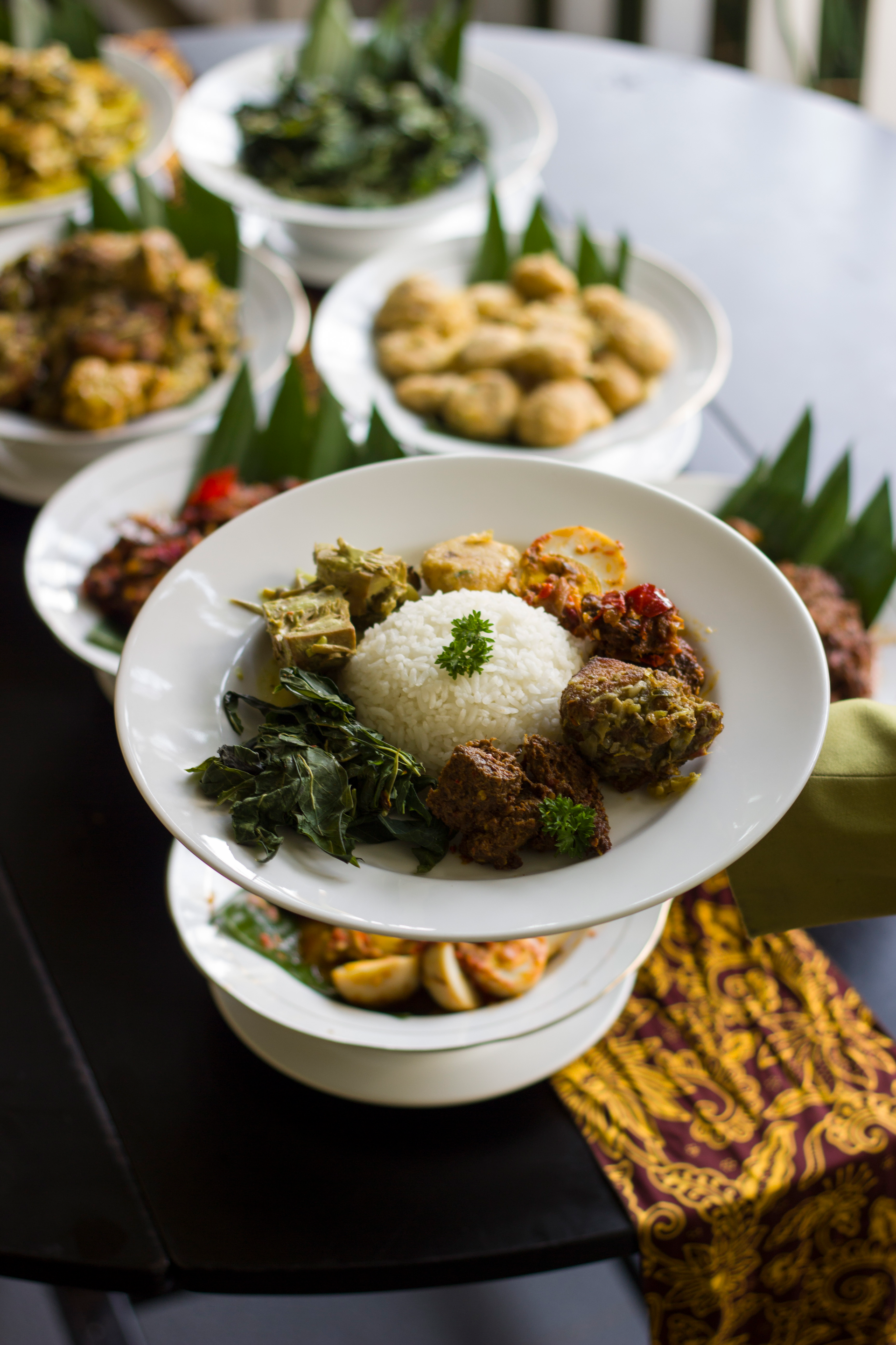 Overhead flat-lay of all ingredients for Aromatic Indonesian Nasi Uduk laid out on a kitchen surface.