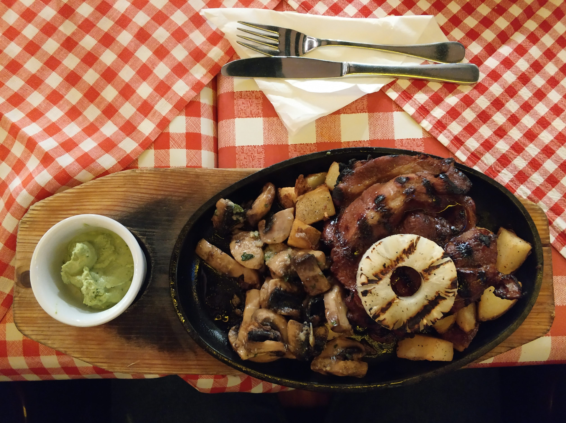 Overhead flat-lay of all ingredients for Aromatic Jamaican Jerk Pork with Fried Plantains laid out on a kitchen surface.