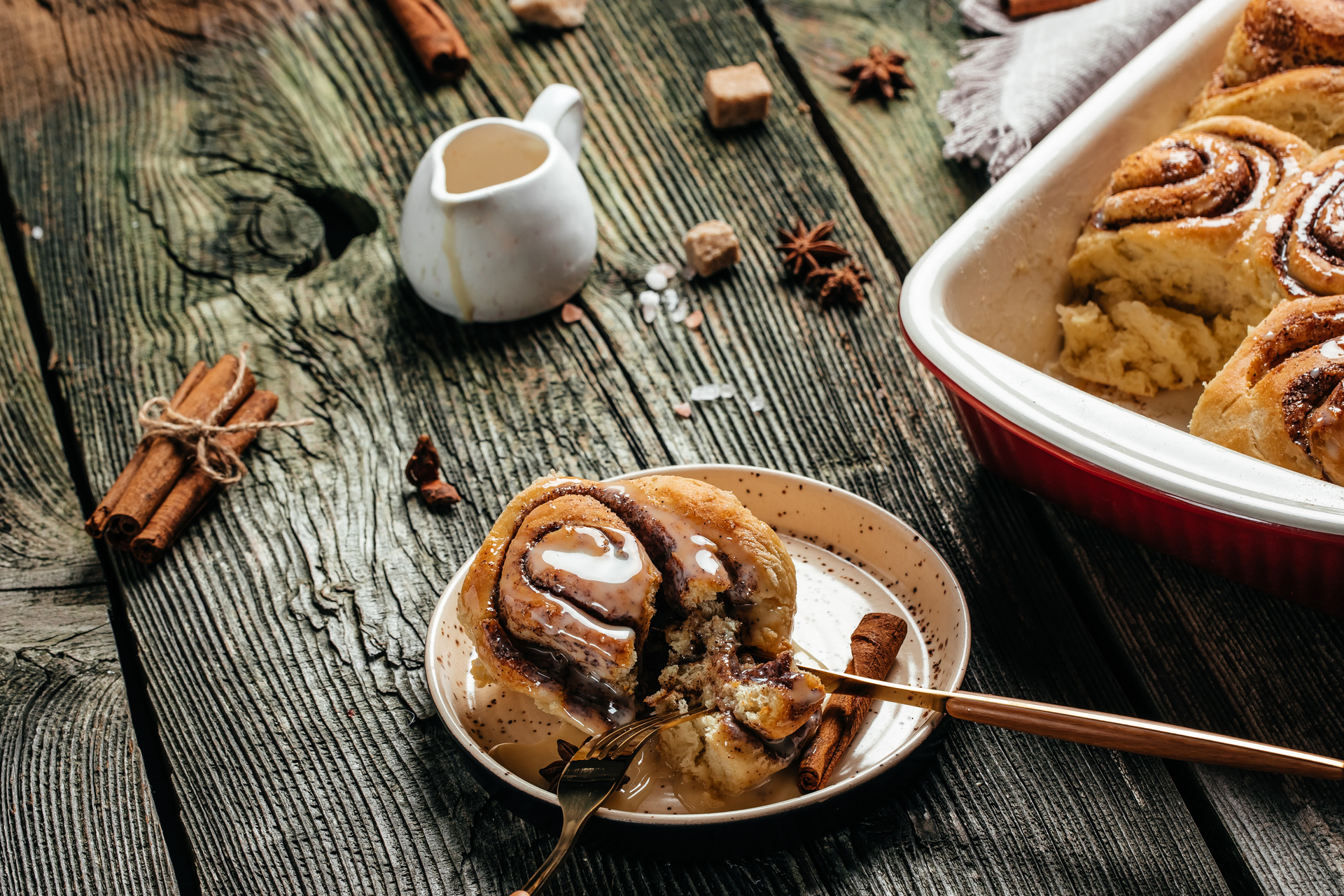 Overhead flat-lay of all ingredients for Aromatic Kürtőskalács with Cinnamon and Walnut Infusion laid out on a kitchen surface.