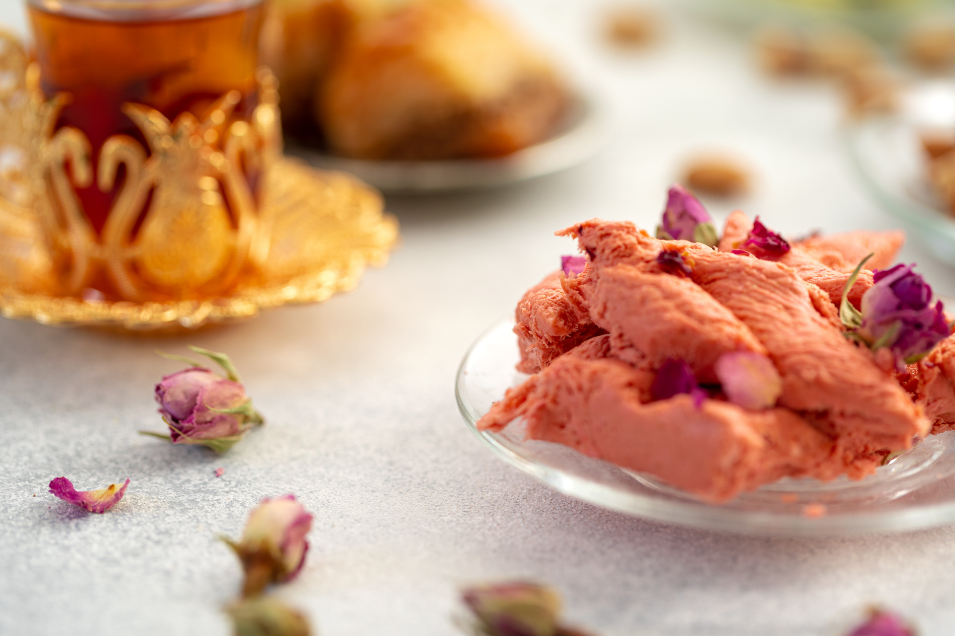 Overhead flat-lay of all ingredients for Aromatic Lebanese Baklava Ice Cream with Rosewater and Pistachios laid out on a kitchen surface.