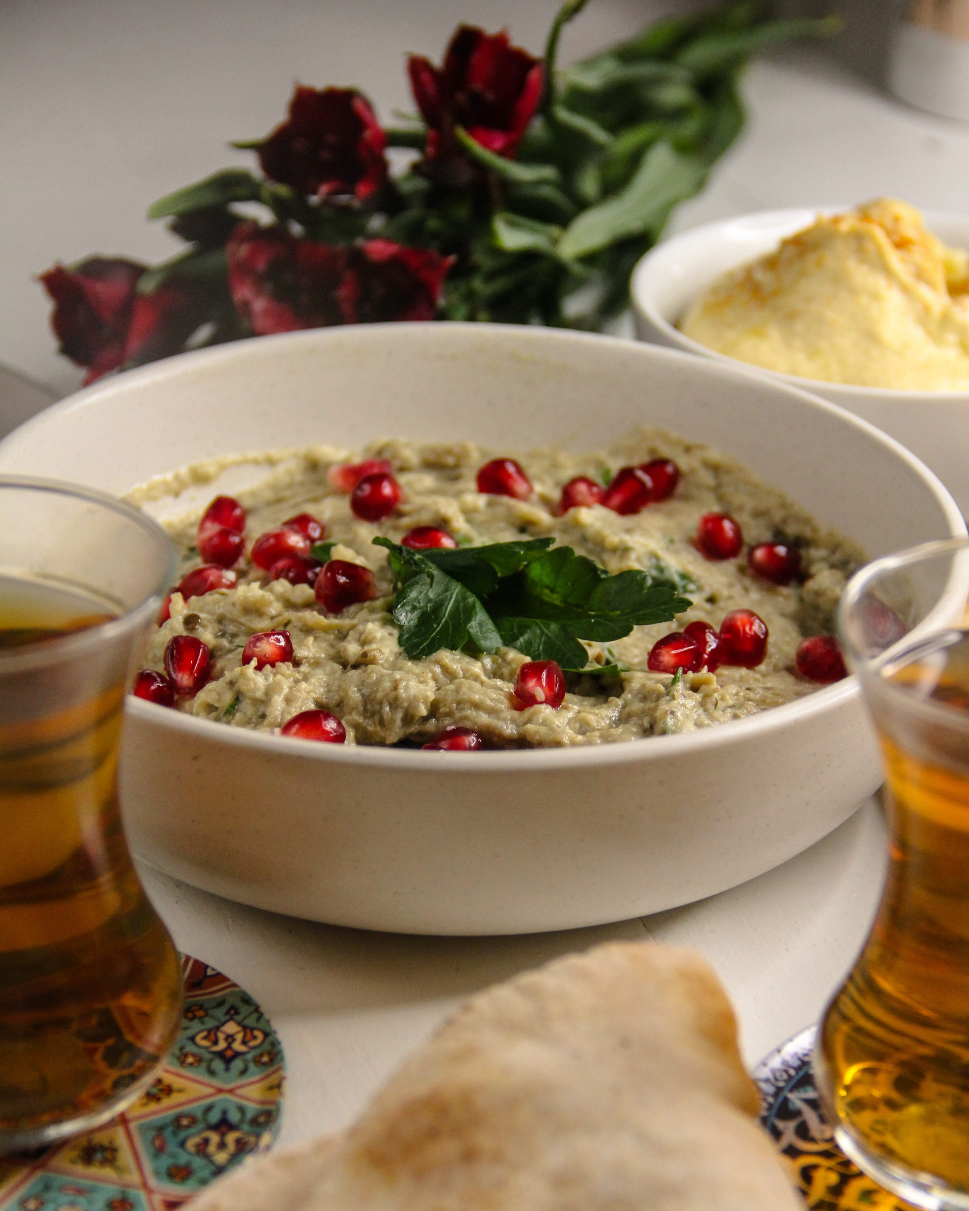 Overhead flat-lay of all ingredients for Aromatic Lebanese Fatteh with Chickpeas and Yogurt laid out on a kitchen surface.
