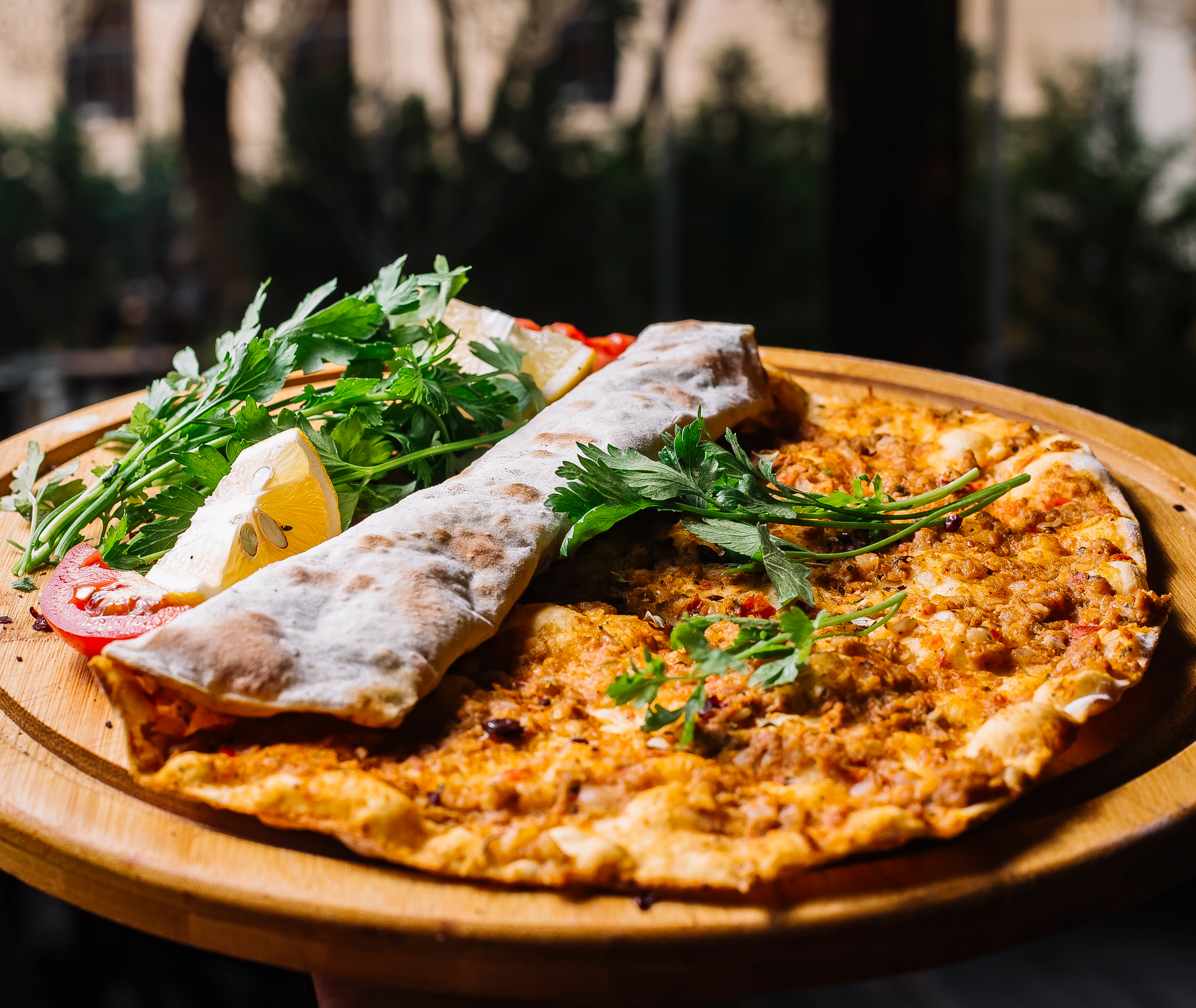 Overhead flat-lay of all ingredients for Aromatic Lebanese Zaatar Flatbread with Sumac Dust laid out on a kitchen surface.