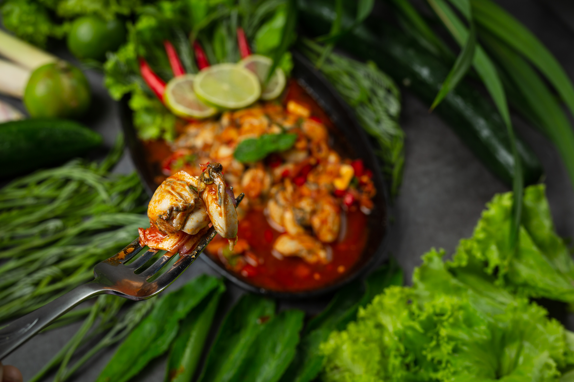 Overhead flat-lay of all ingredients for Aromatic Malaysian Prawn Sambal with Kaffir Lime laid out on a kitchen surface.