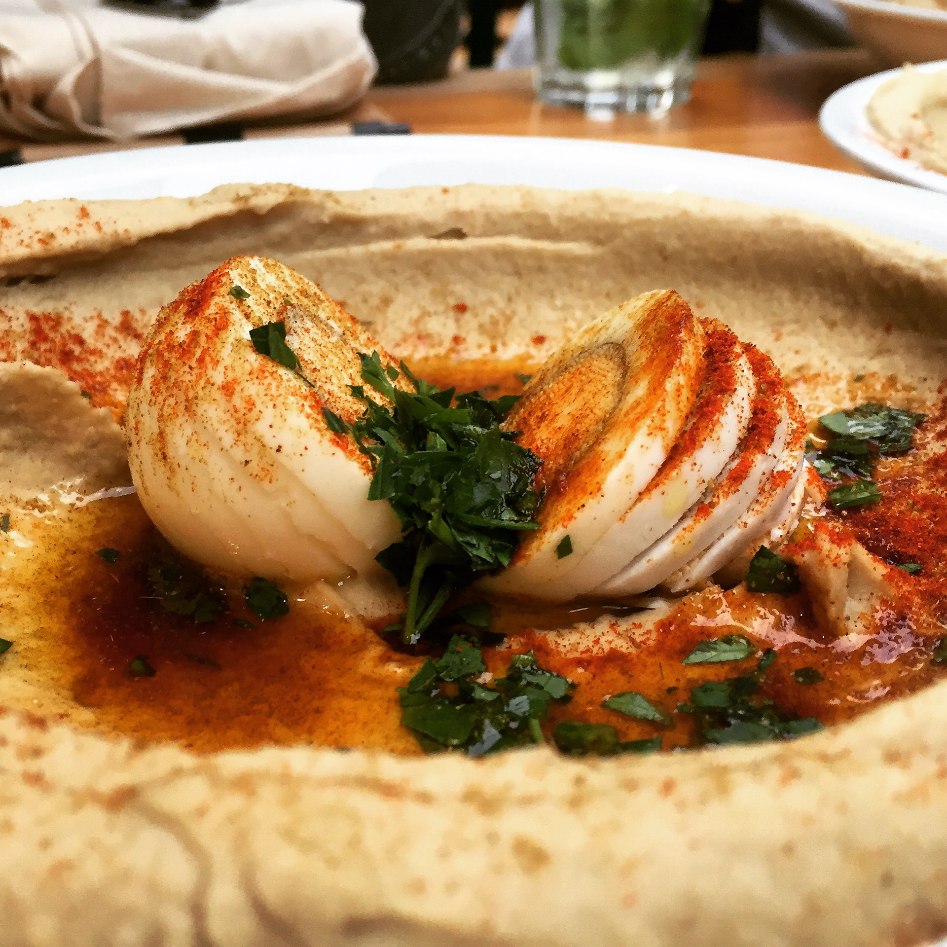 Overhead flat-lay of all ingredients for Aromatic Palestinian Musakhan with Sumac-Spiced Chicken and Onions laid out on a kitchen surface.