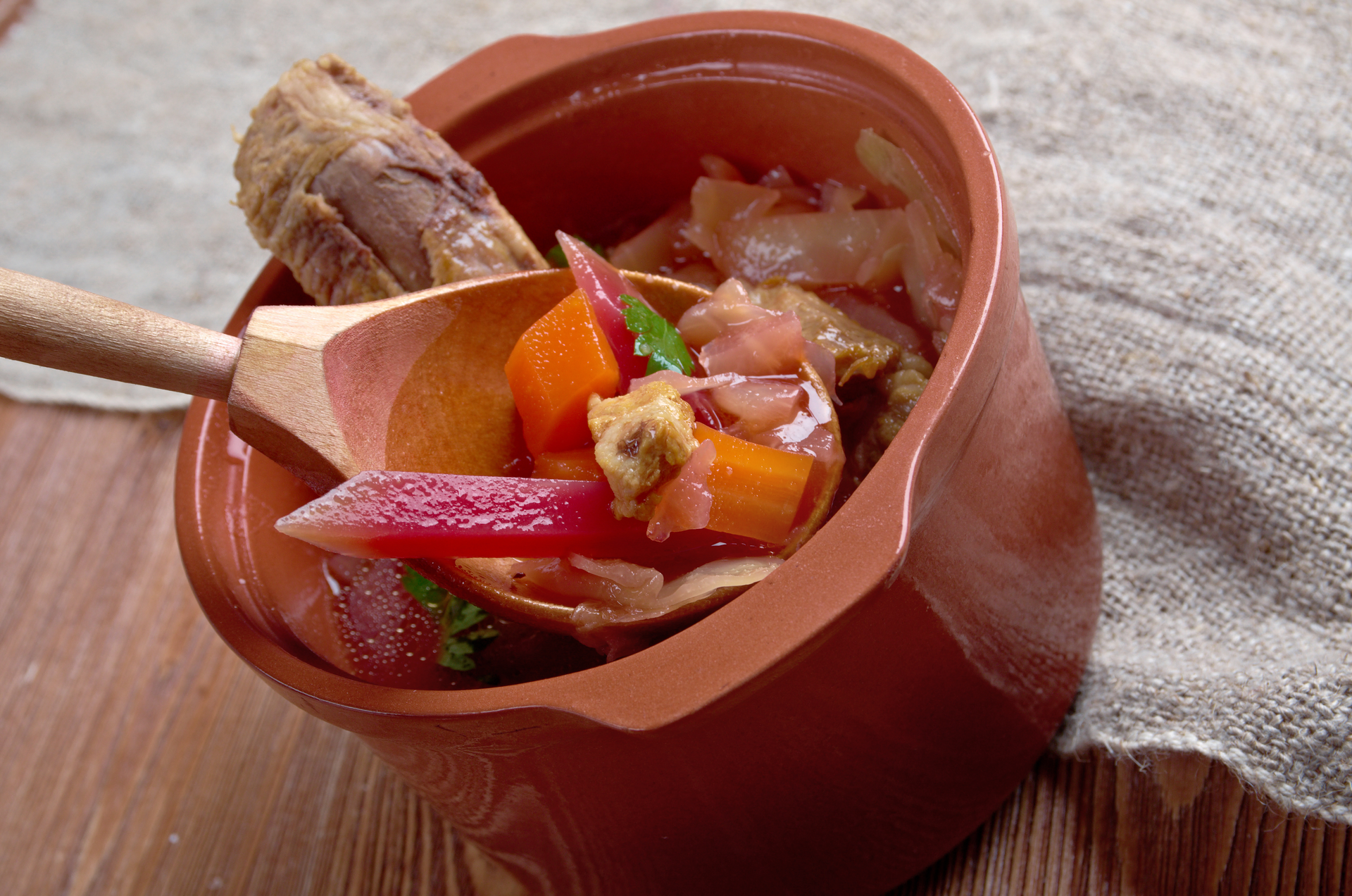Overhead flat-lay of all ingredients for Aromatic Panamanian Sancocho with Root Vegetables laid out on a kitchen surface.