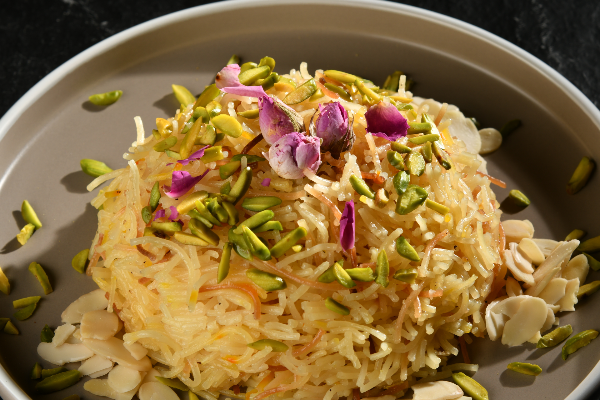 Overhead flat-lay of all ingredients for Aromatic Persian Faloodeh laid out on a kitchen surface.
