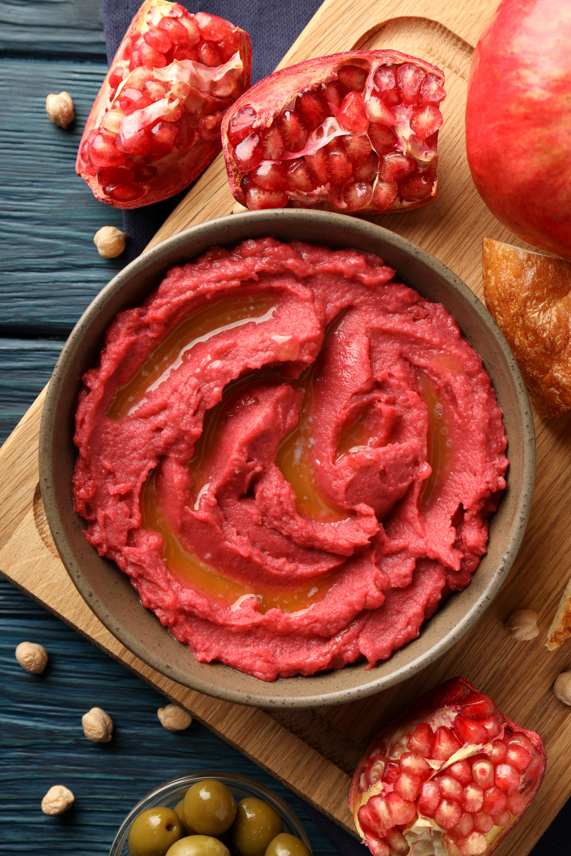 Overhead flat-lay of all ingredients for Aromatic Syrian Muhammara Dip with Pomegranate Molasses laid out on a kitchen surface.