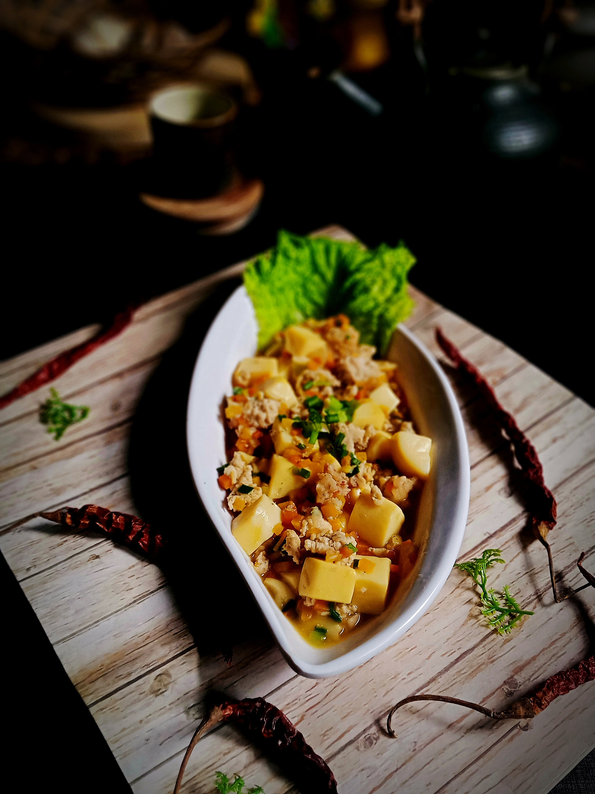 Overhead flat-lay of all ingredients for Aromatic Thai Massaman Curry with Potatoes and Peanuts laid out on a kitchen surface.