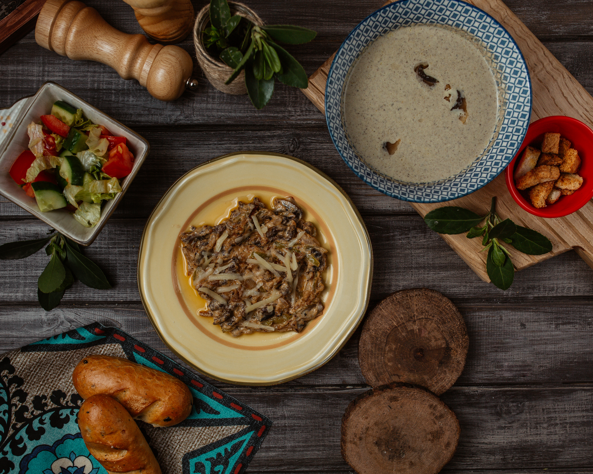 Overhead flat-lay of all ingredients for Aromatic Turkish Kestaneli Tavuk with Chestnuts and Mushroom Broth laid out on a kitchen surface.