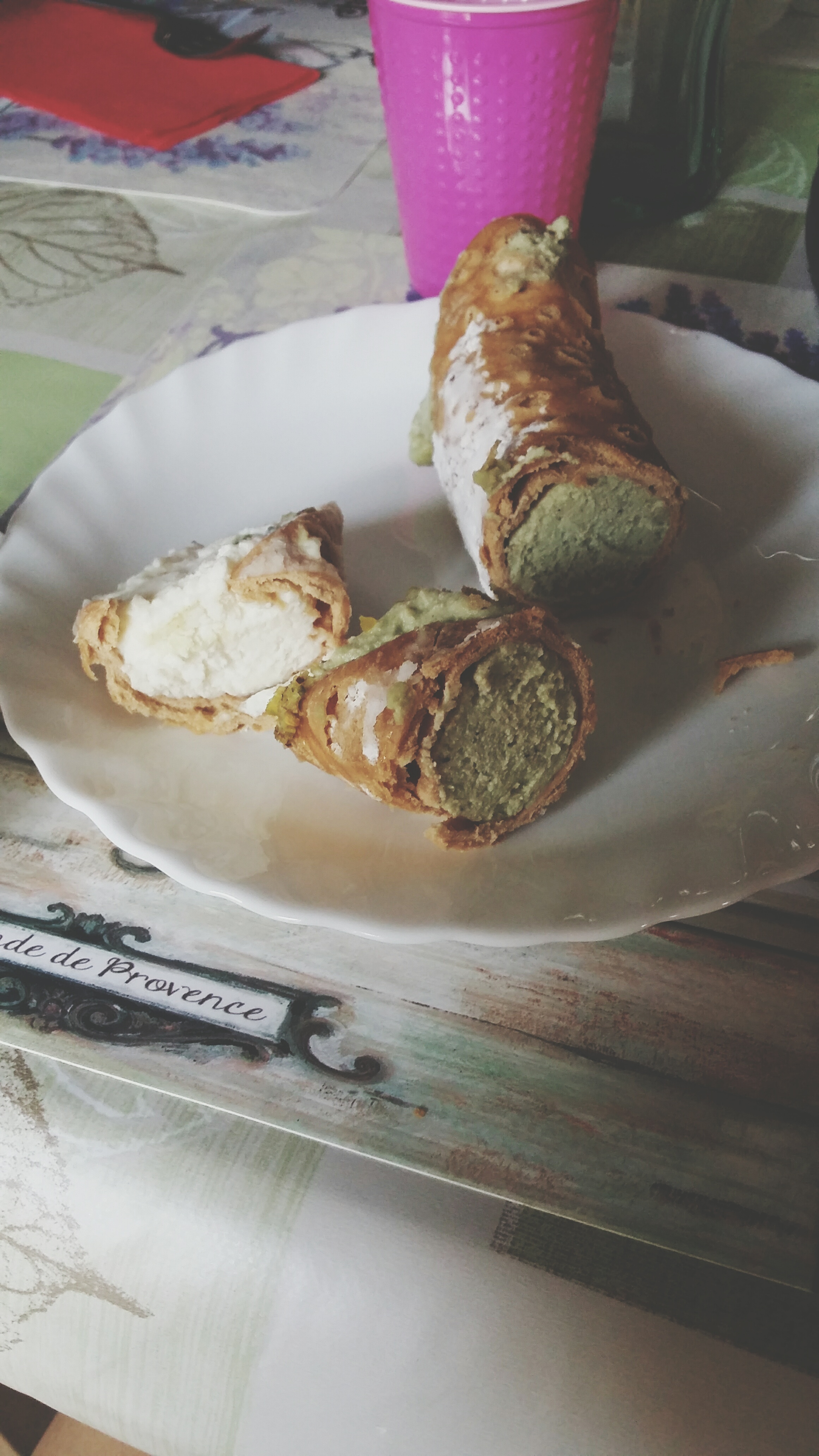 Overhead flat-lay of all ingredients for Artisanal Brioche with Lemon Ricotta and Pistachio Dust laid out on a kitchen surface.
