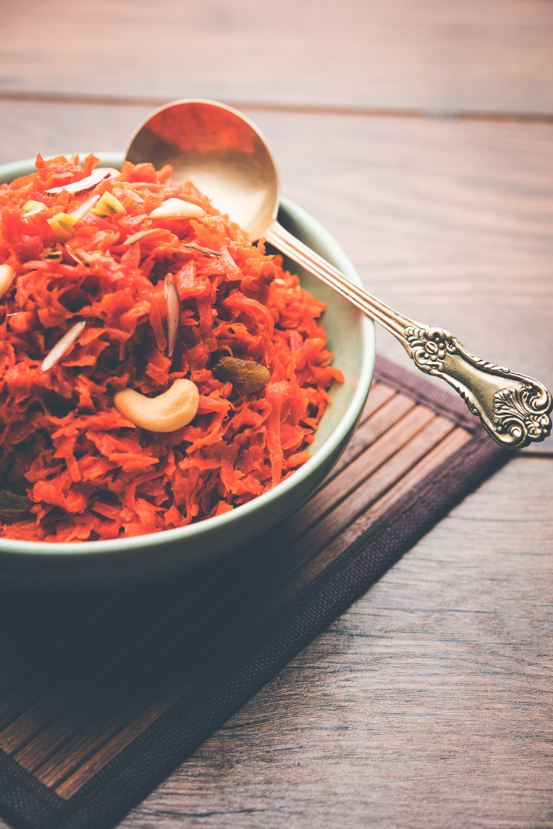 Overhead flat-lay of all ingredients for Baked Pakistani Chicken Biryani with Ginger and Saffron laid out on a kitchen surface.
