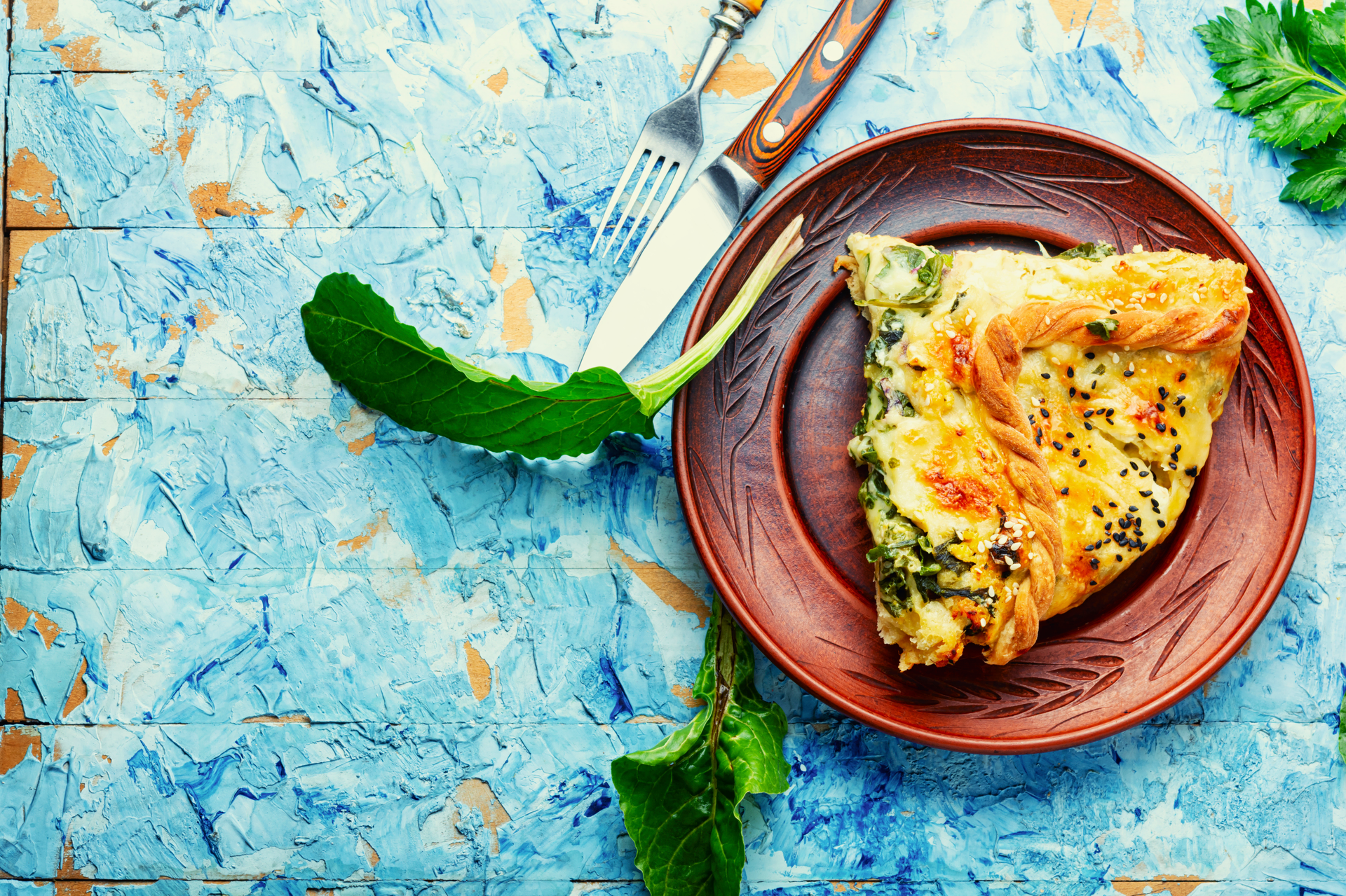 Overhead flat-lay of all ingredients for Bold Iranian Mixed Herb Frittata with Saffron and Dill laid out on a kitchen surface.