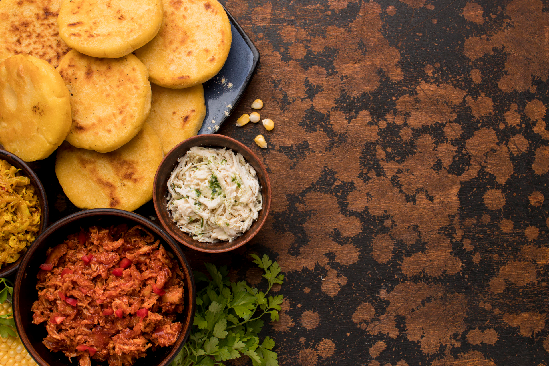 Overhead flat-lay of all ingredients for Bolivian Salteñas laid out on a kitchen surface.
