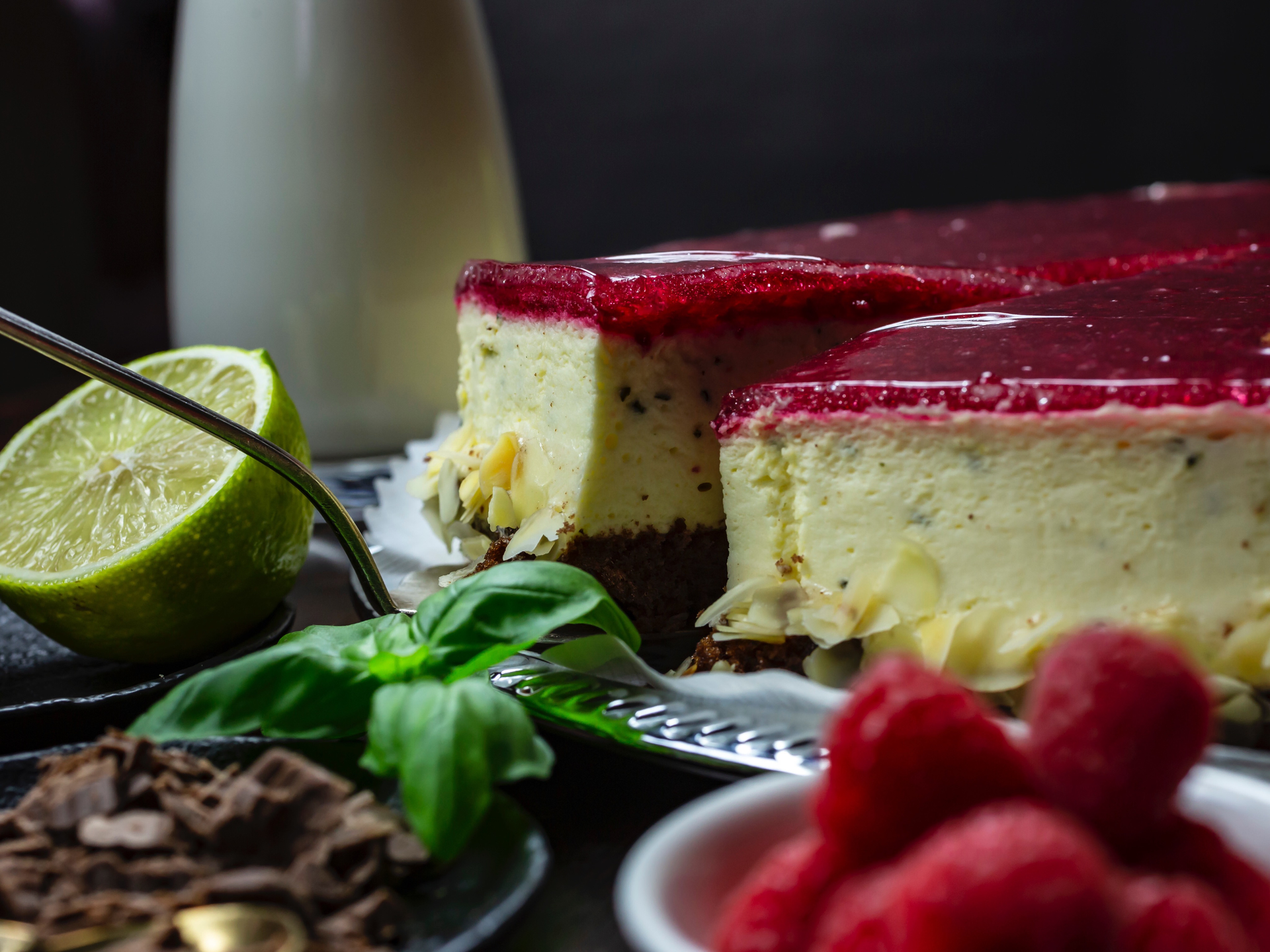 Overhead flat-lay of all ingredients for Brazilian Açai Mojito Cheesecake with Coconut Lime Crust laid out on a kitchen surface.