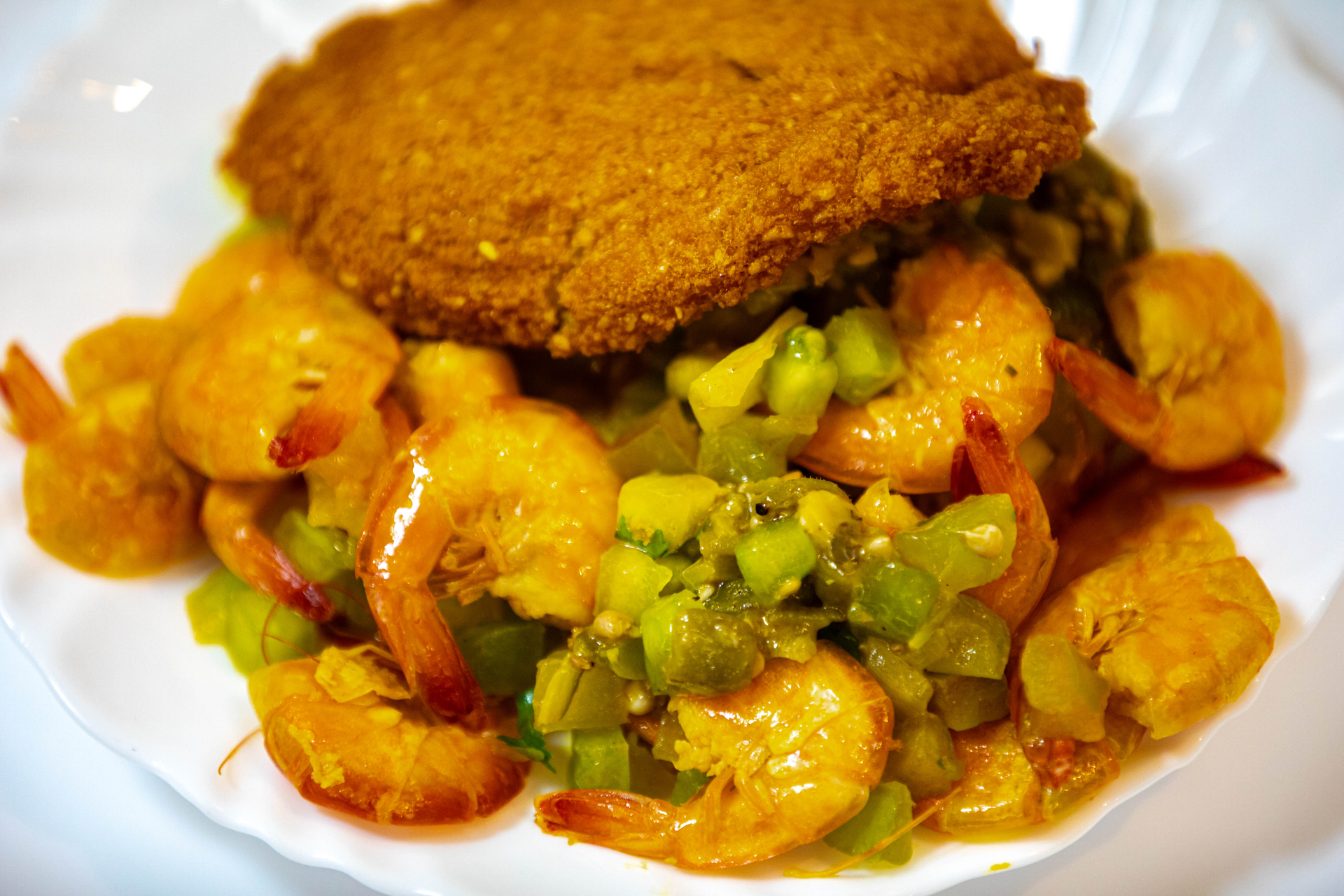 Overhead flat-lay of all ingredients for Brazilian Acarajé Fritters with Shrimp and Okra laid out on a kitchen surface.