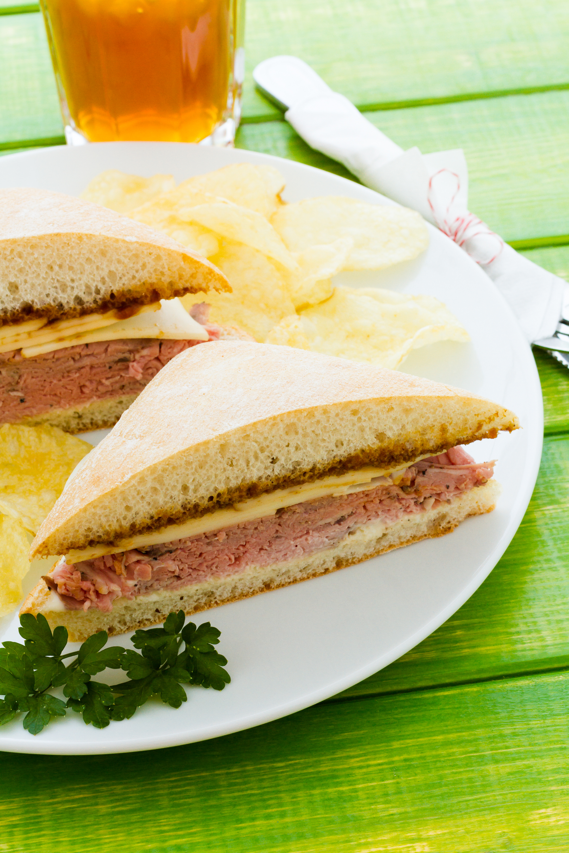 Brazilian Cheese Bread Sandwich with Mortadella and Herb Aioli — Snack served and photographed from above