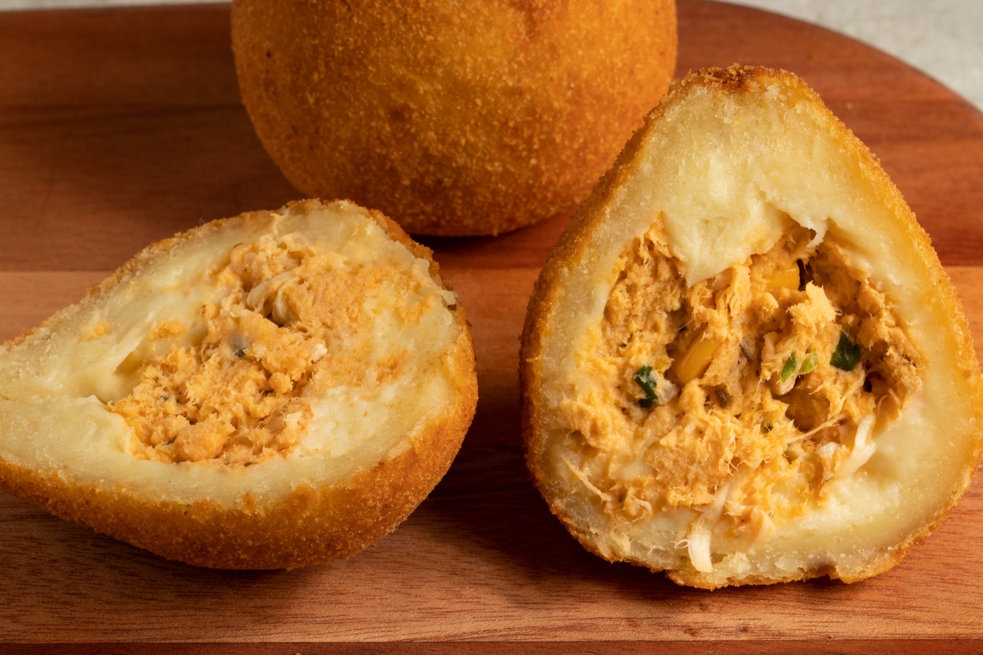 Overhead flat-lay of all ingredients for Brazilian Coxinha with Creamy Chicken Filling laid out on a kitchen surface.
