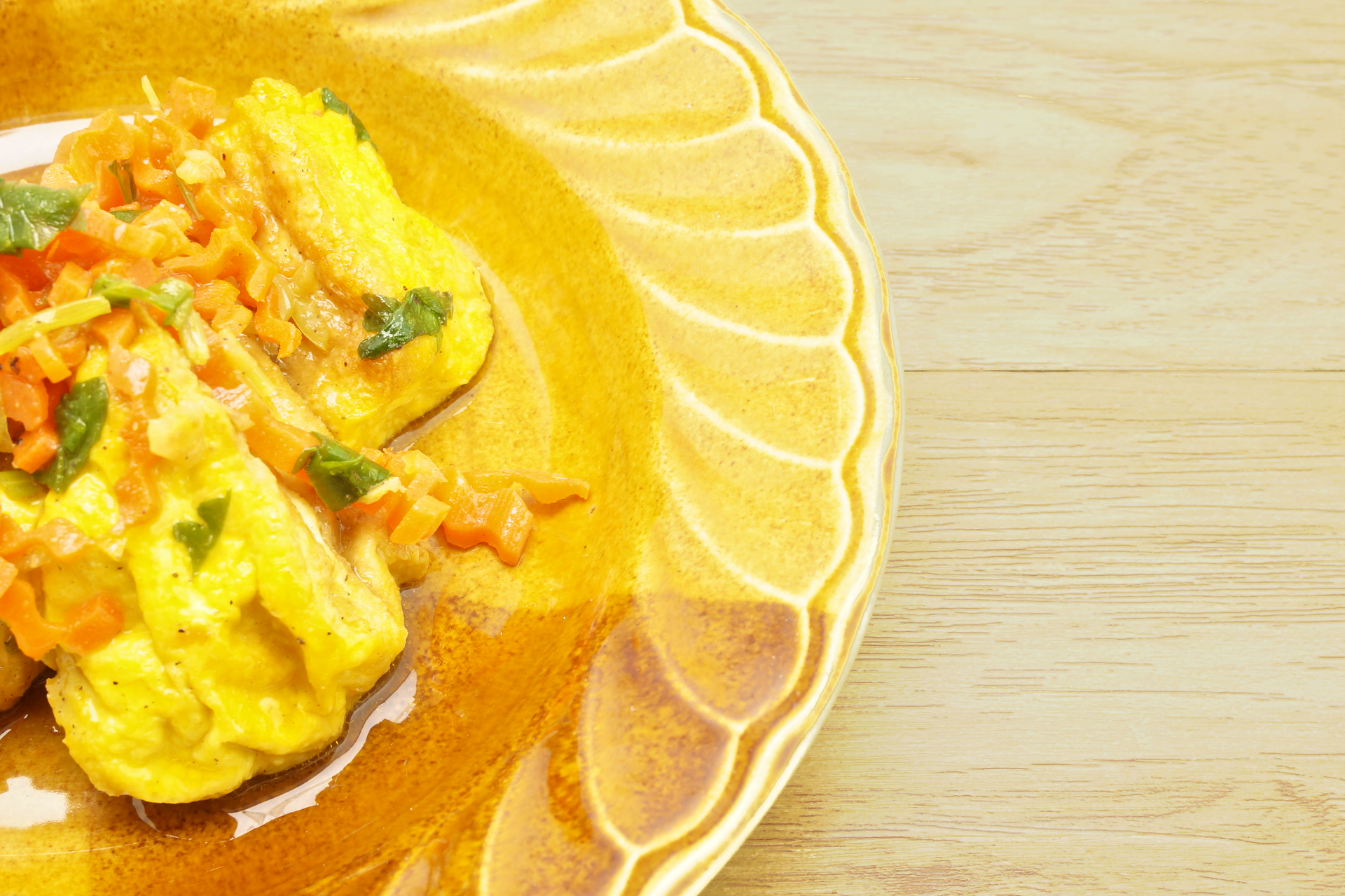 Overhead flat-lay of all ingredients for Brazilian Moqueca Baiana with Dendê Oil laid out on a kitchen surface.