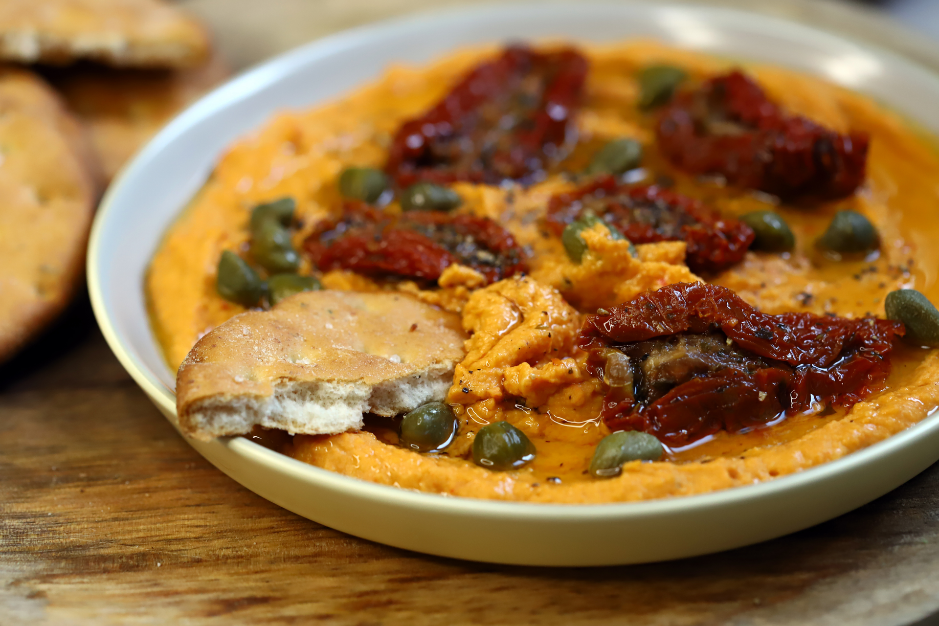 Overhead flat-lay of all ingredients for Brazilian Moqueca de Siri laid out on a kitchen surface.