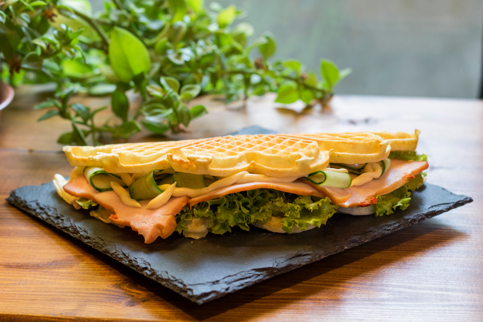 Overhead flat-lay of all ingredients for Brazilian Tapioca Waffle Sandwich with Guava and Cheese laid out on a kitchen surface.
