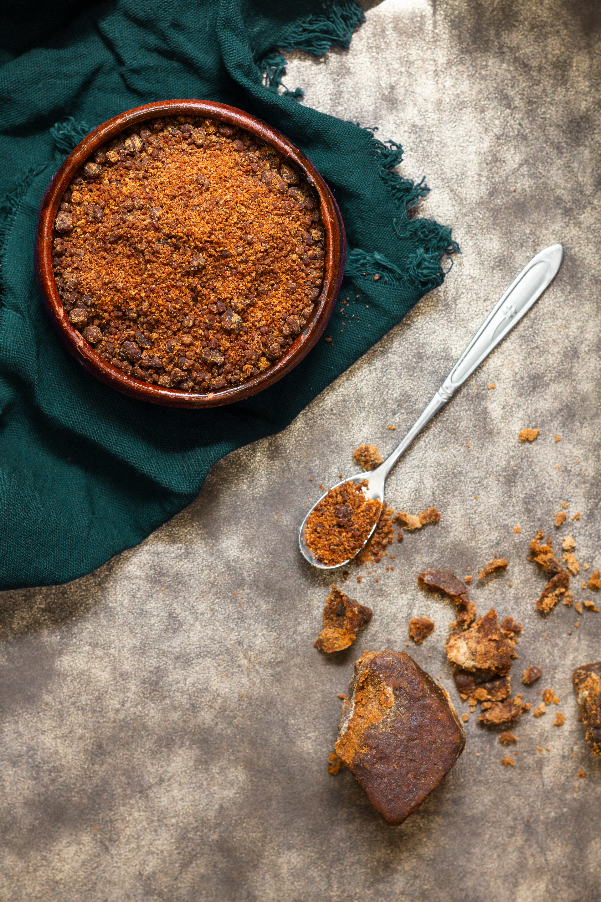 Overhead flat-lay of all ingredients for British Sticky Toffee Pudding with Dark Muscovado Sugar laid out on a kitchen surface.