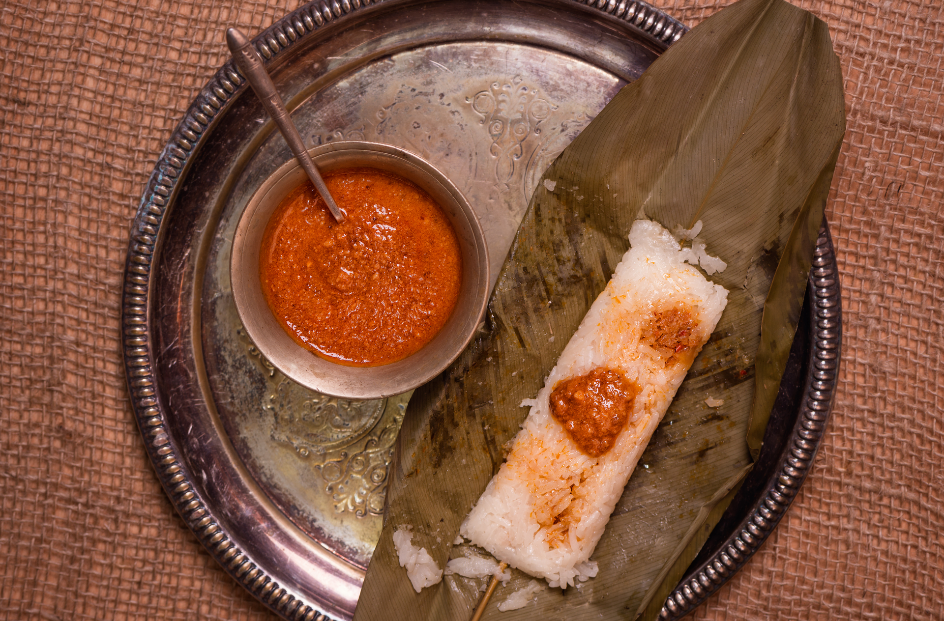 Overhead flat-lay of all ingredients for Bubbling Indian Fermented Rice Dosas with Spicy Tomato Chutney laid out on a kitchen surface.