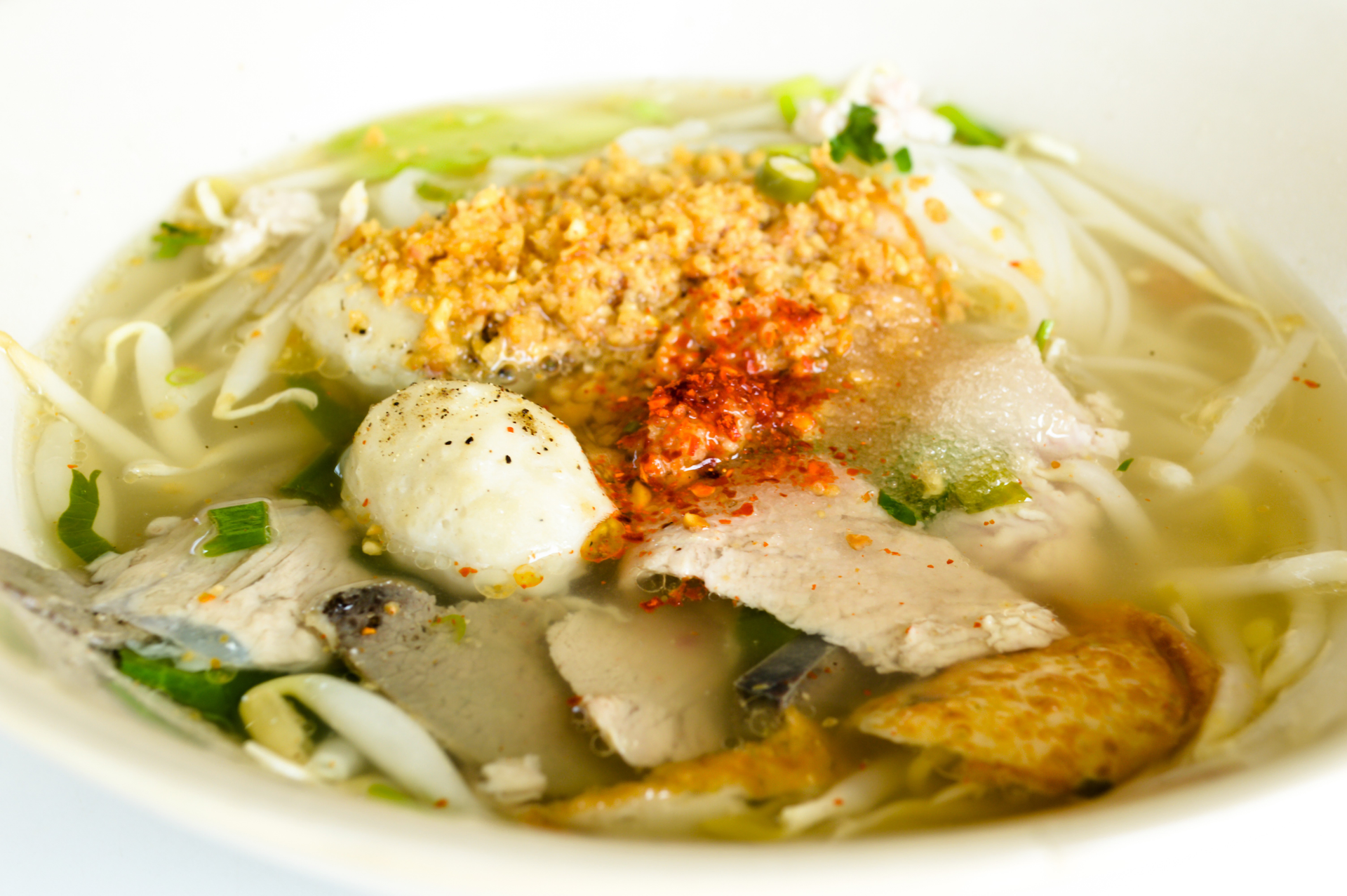Burmese Coconut Noodle Soup with Lemongrass Chicken — Main Course served and photographed from above