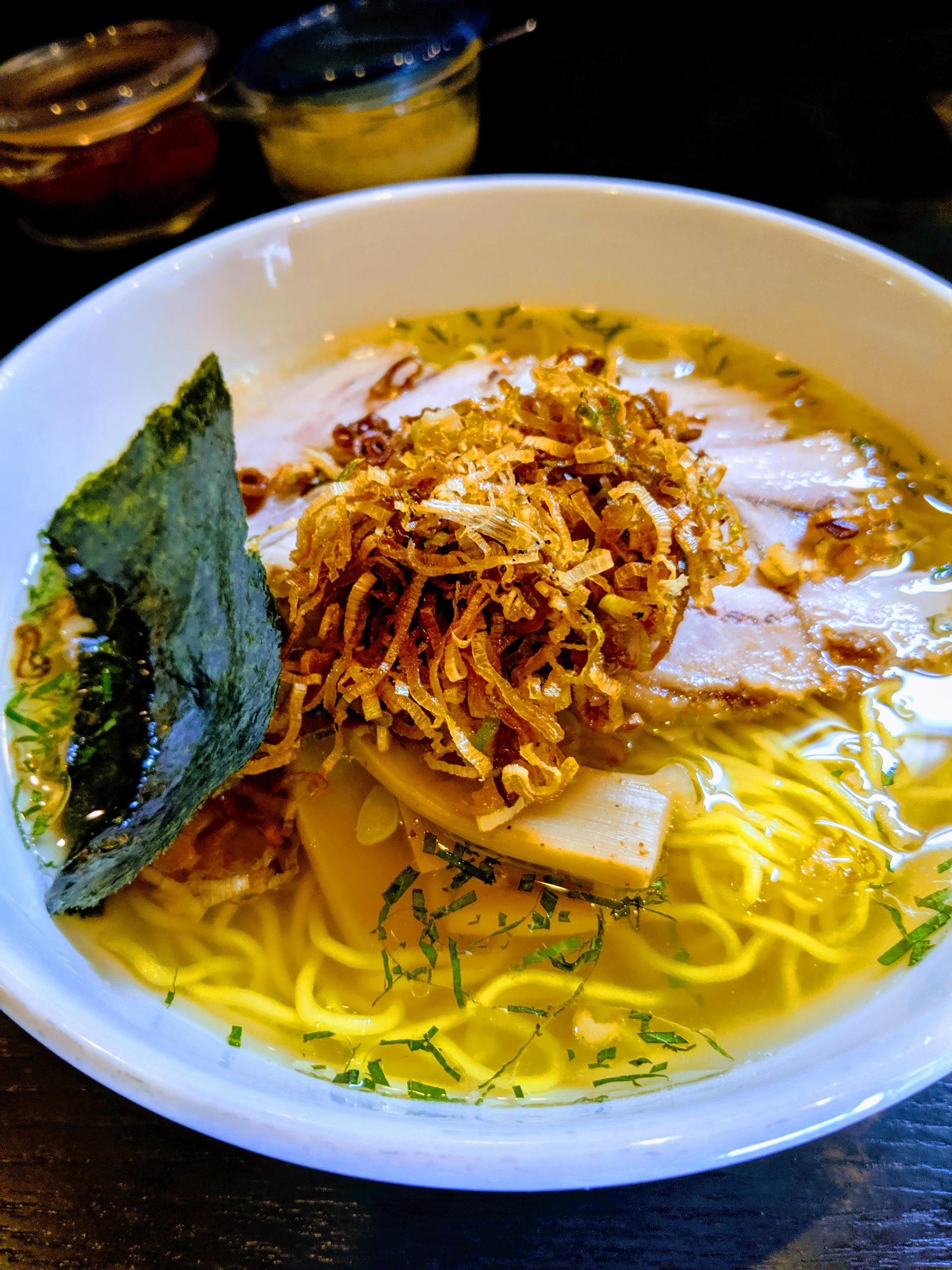 Overhead flat-lay of all ingredients for Burmese Mohinga with Lemongrass and Crispy Shallots laid out on a kitchen surface.