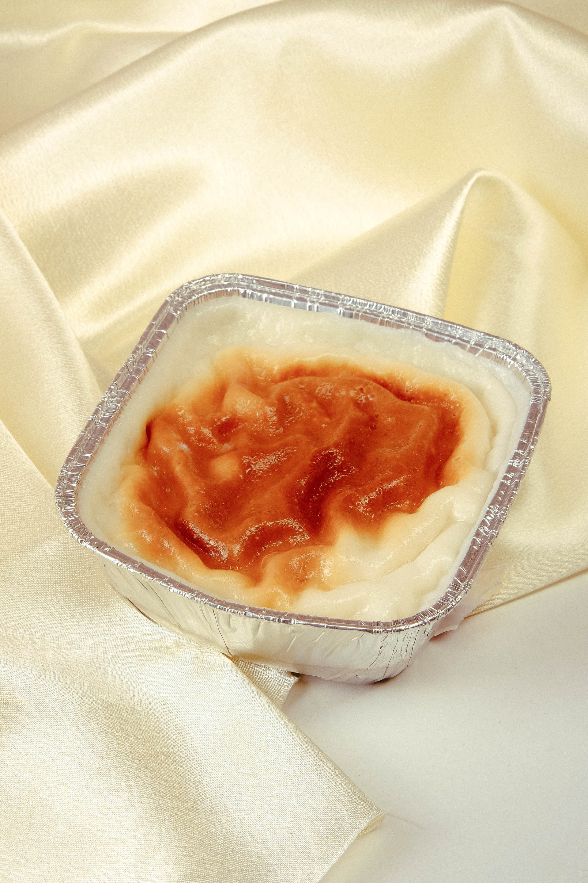 Overhead flat-lay of all ingredients for Buttery Brazilian Tapioca Pudding with Dulce de Leche laid out on a kitchen surface.