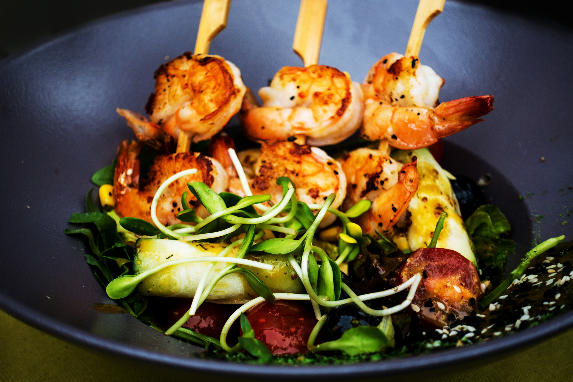 Overhead flat-lay of all ingredients for Cajun Blackened Shrimp with Creole Corn Salad laid out on a kitchen surface.