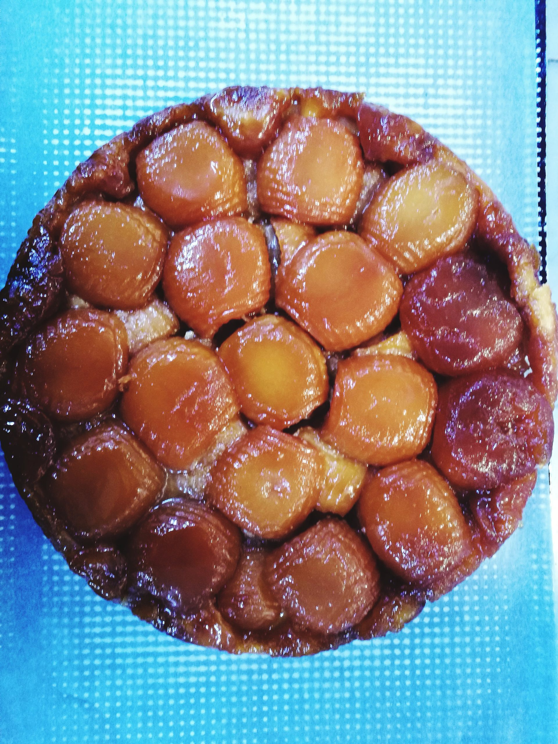 Overhead flat-lay of all ingredients for Caramelized French Tarte Tatin laid out on a kitchen surface.