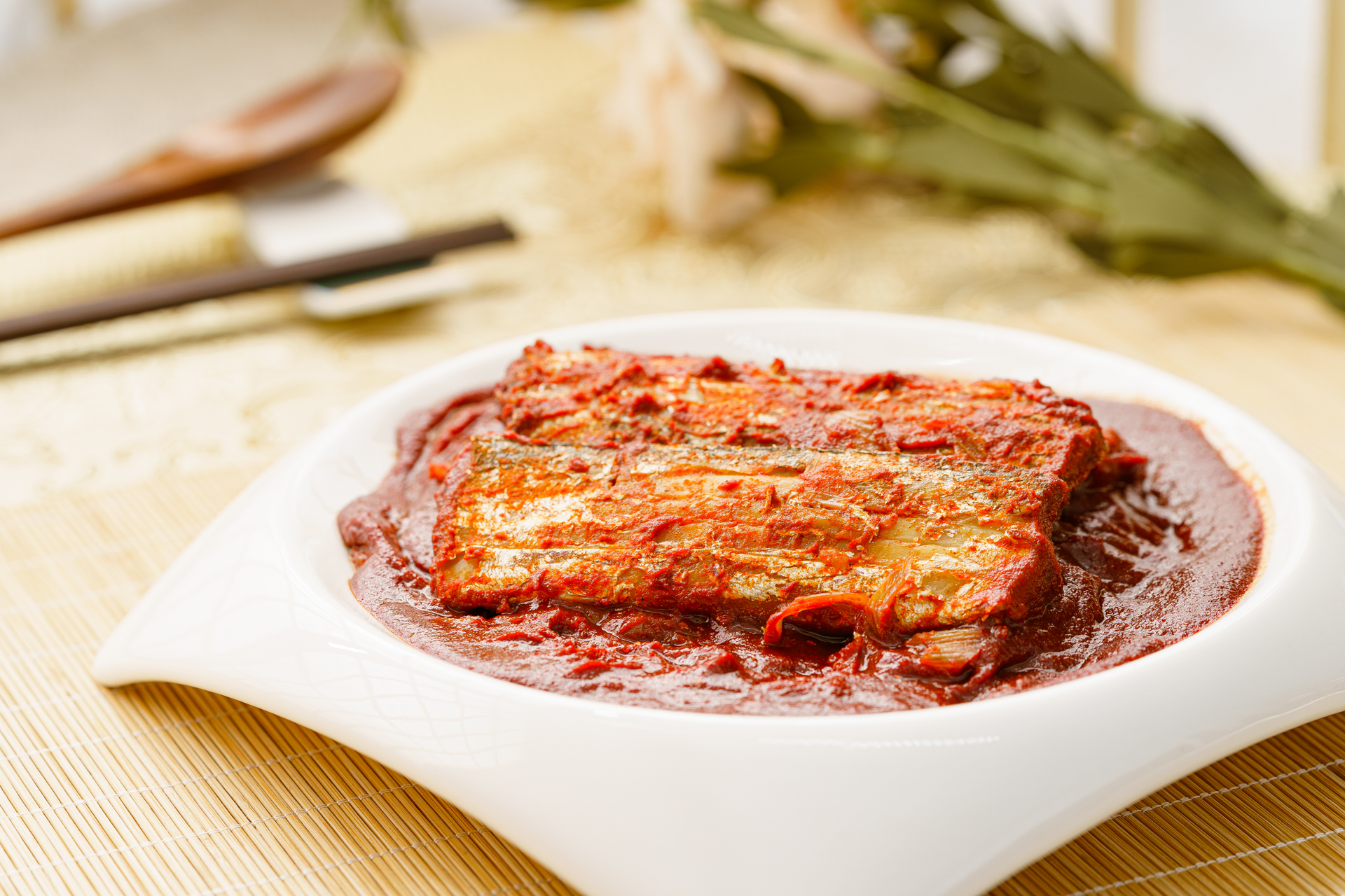 Overhead flat-lay of all ingredients for Caramelized Korean Pork Belly with Spicy Kimchi Glaze laid out on a kitchen surface.