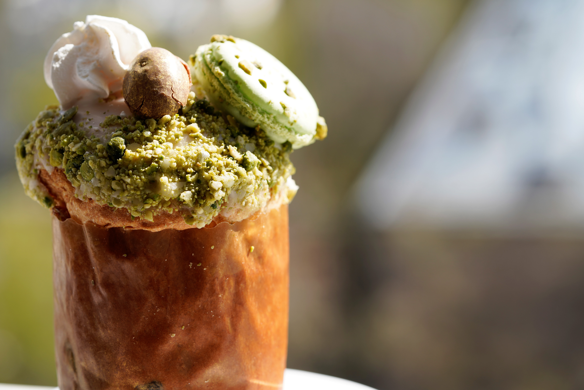 Overhead flat-lay of all ingredients for Caramelized Turkish Delight Ice Cream with Pistachio Crunch laid out on a kitchen surface.
