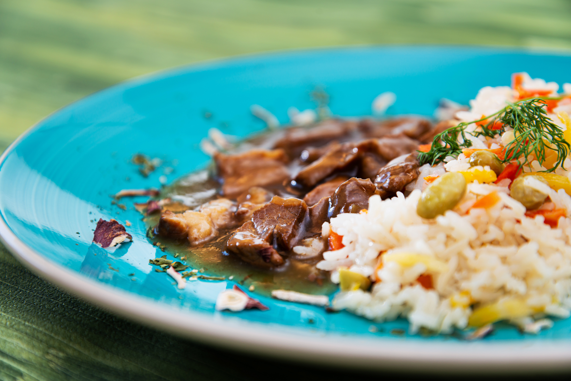 Overhead flat-lay of all ingredients for Caribbean Ginger Beer Braised Beef Brisket with Cilantro Rice laid out on a kitchen surface.