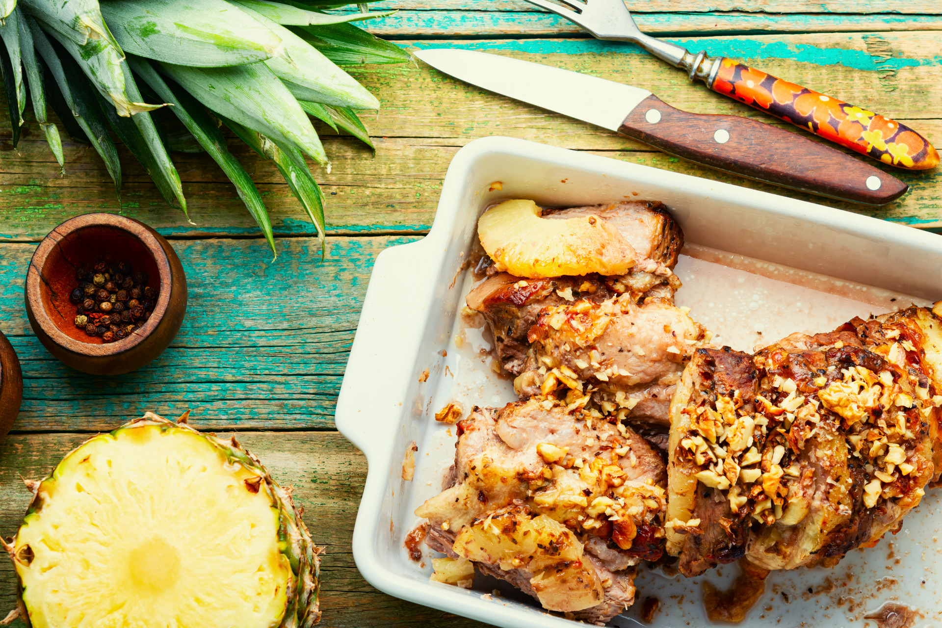 Overhead flat-lay of all ingredients for Caribbean Grilled Jerk Chicken with Pineapple Salsa laid out on a kitchen surface.