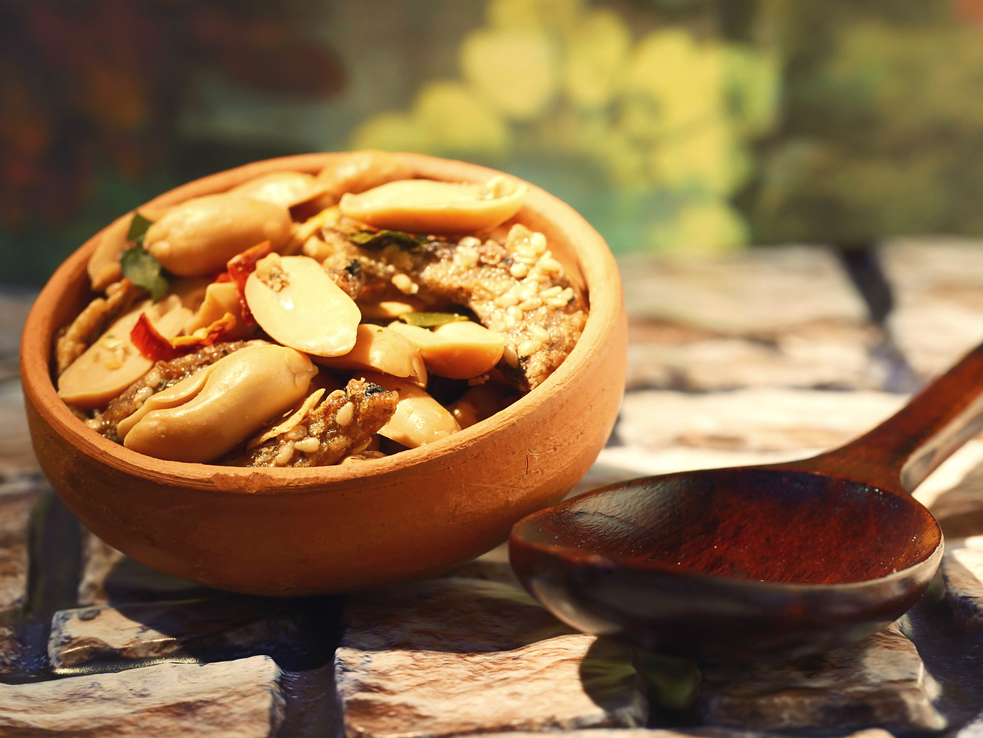 Overhead flat-lay of all ingredients for Caribbean Pepper Pot Stew with Cashews and Cowpeas laid out on a kitchen surface.