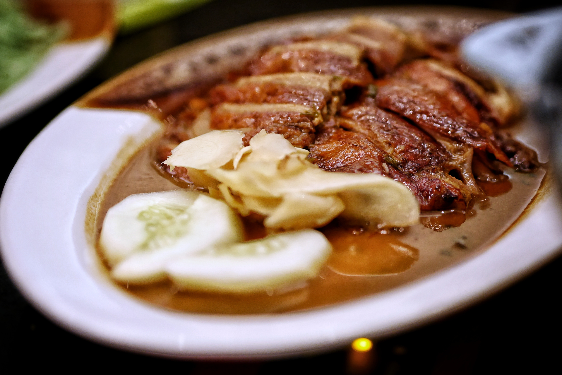 Overhead flat-lay of all ingredients for Caribbean Rum-Glazed Duck with Banana Chutney laid out on a kitchen surface.