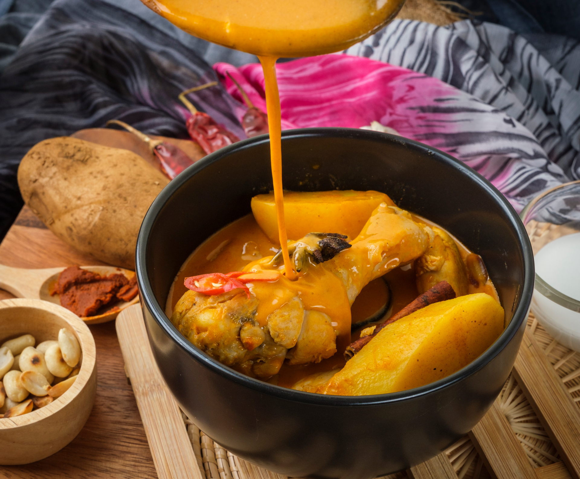 Overhead flat-lay of all ingredients for Caribbean Turmeric Coconut Curry with Fried Plantain and Ginger laid out on a kitchen surface.