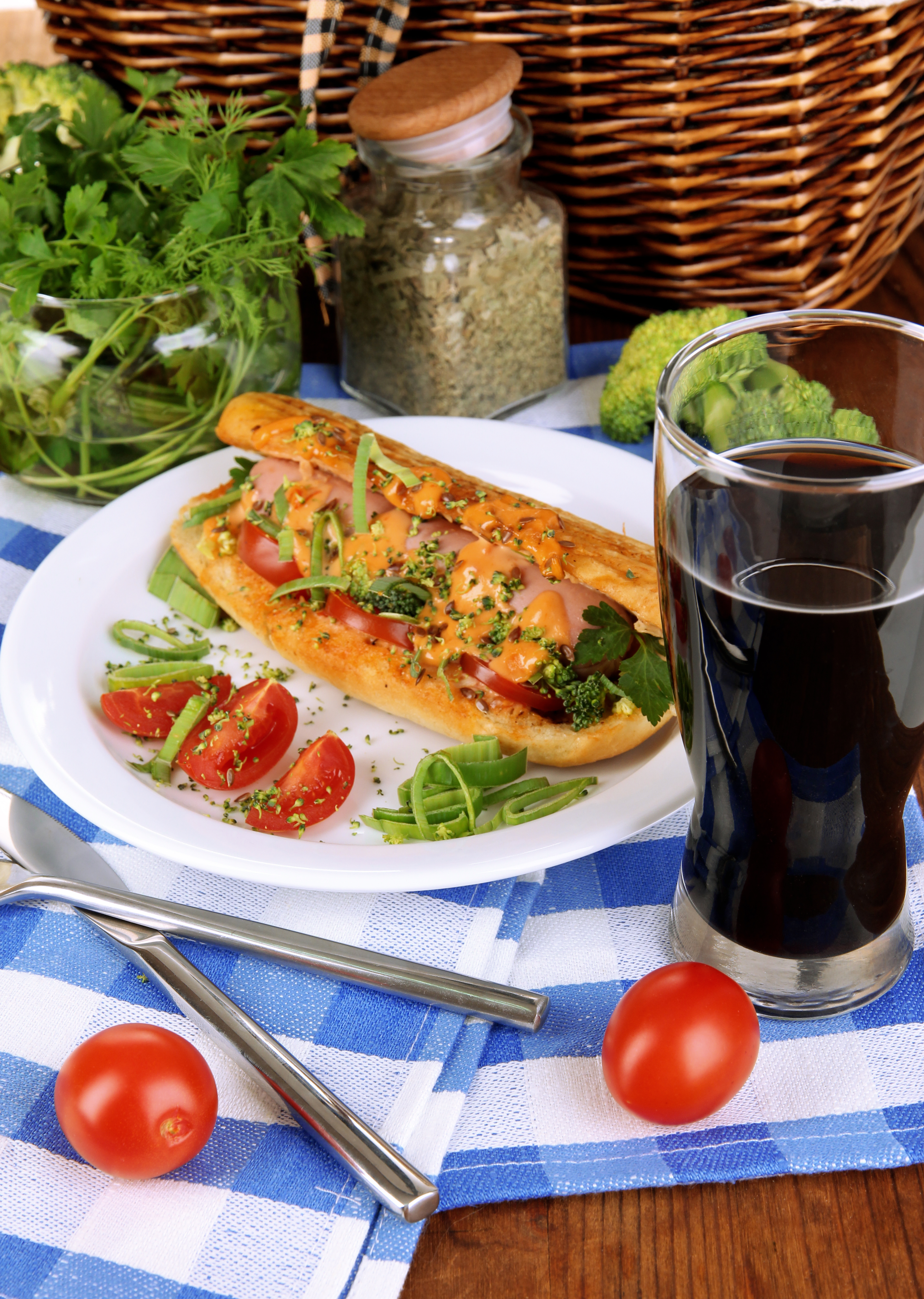 Overhead flat-lay of all ingredients for Catalonian Coca with Escalivada Vegetables and Anchovies laid out on a kitchen surface.